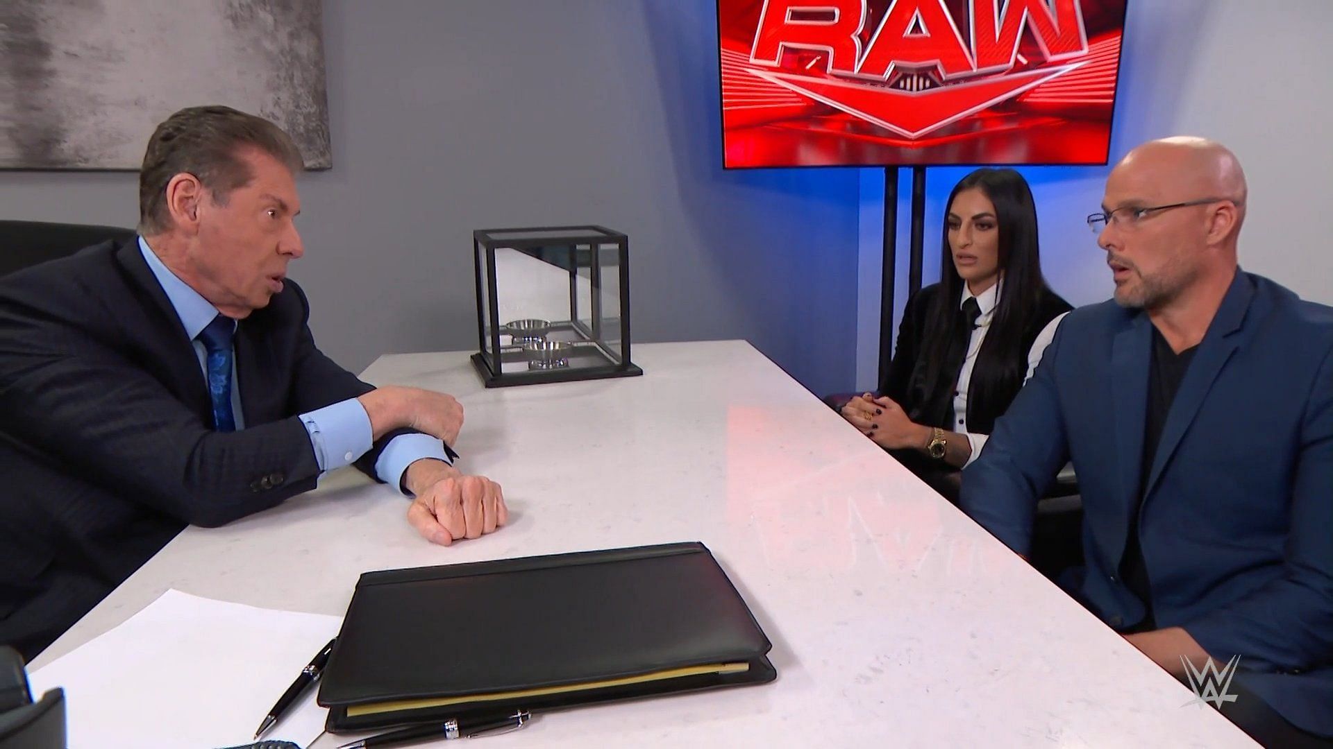 Vince McMahon with Adam Pearce and Sonya Deville