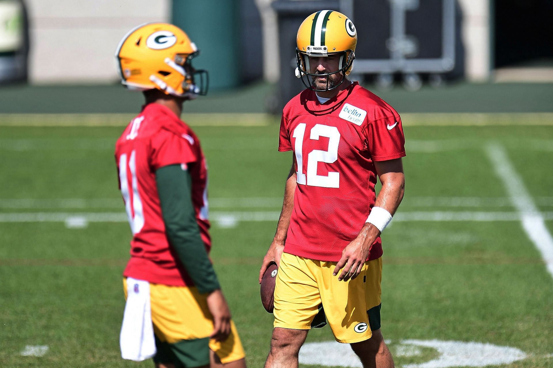 Green Bay Packers quarterback Jordan Love and Aaron Rodgers