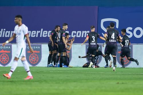 OFC players celebrate scoring against ATKMB. [Credits: ISL]