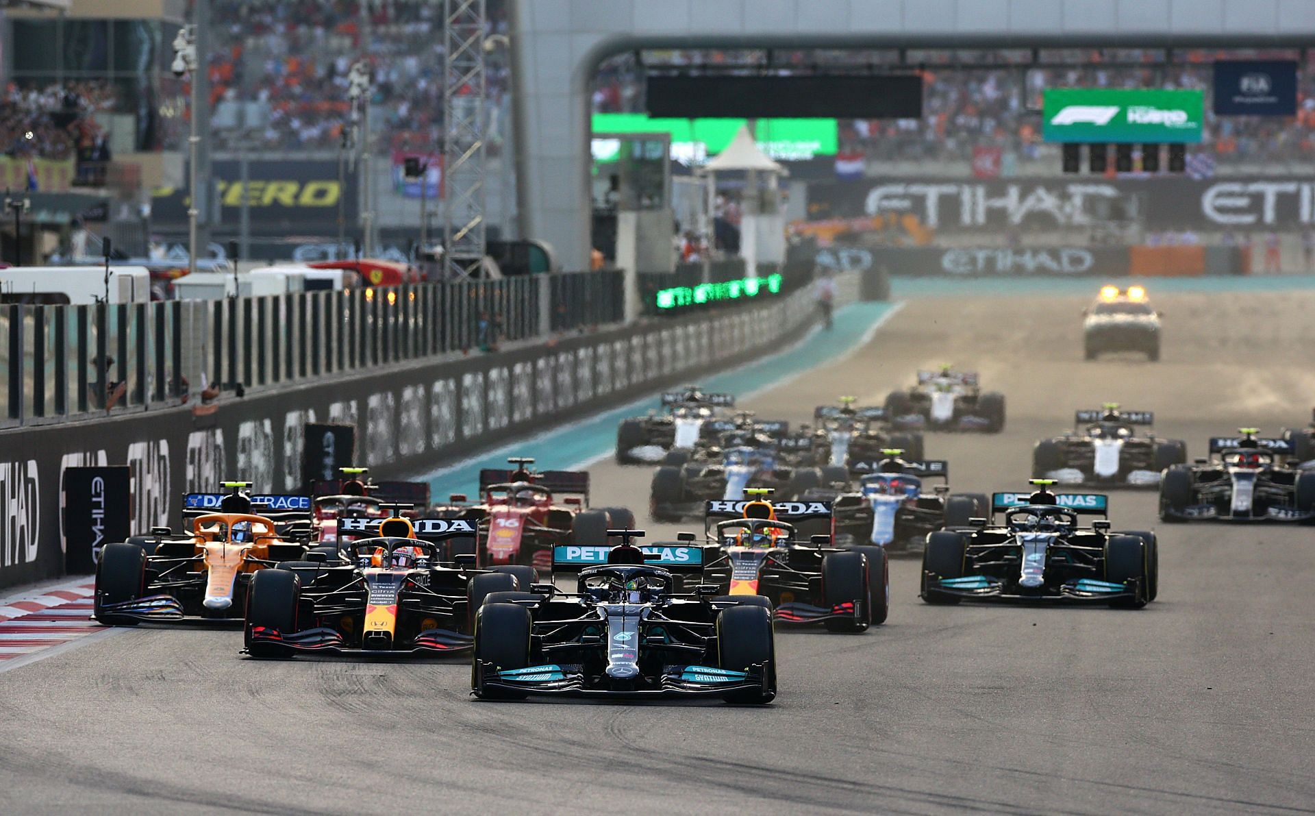 Lewis Hamilton leads Max Verstappen and the rest of the field at the start during the 2021 season finale in Abu Dhabi (Photo by Peter Fox/Getty Images)