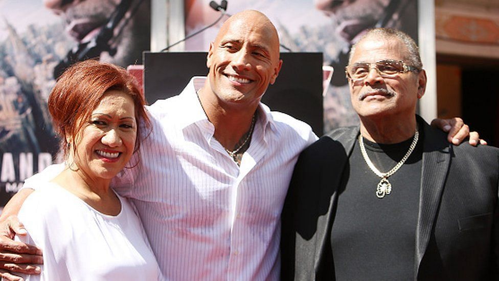 The Rock with his parents at an event