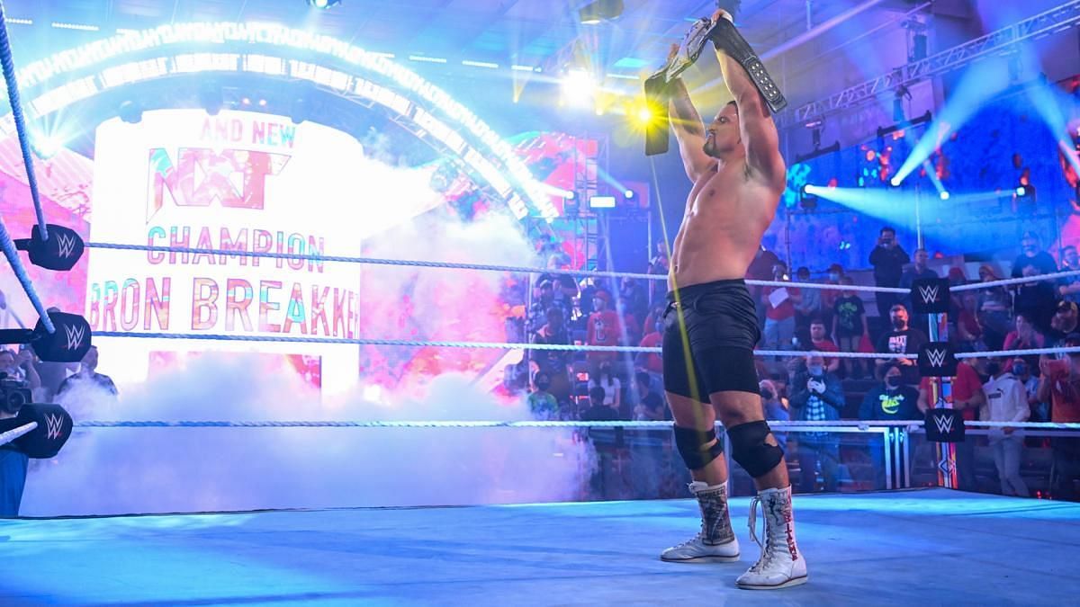 Bron Breakker holds aloft the NXT Championship