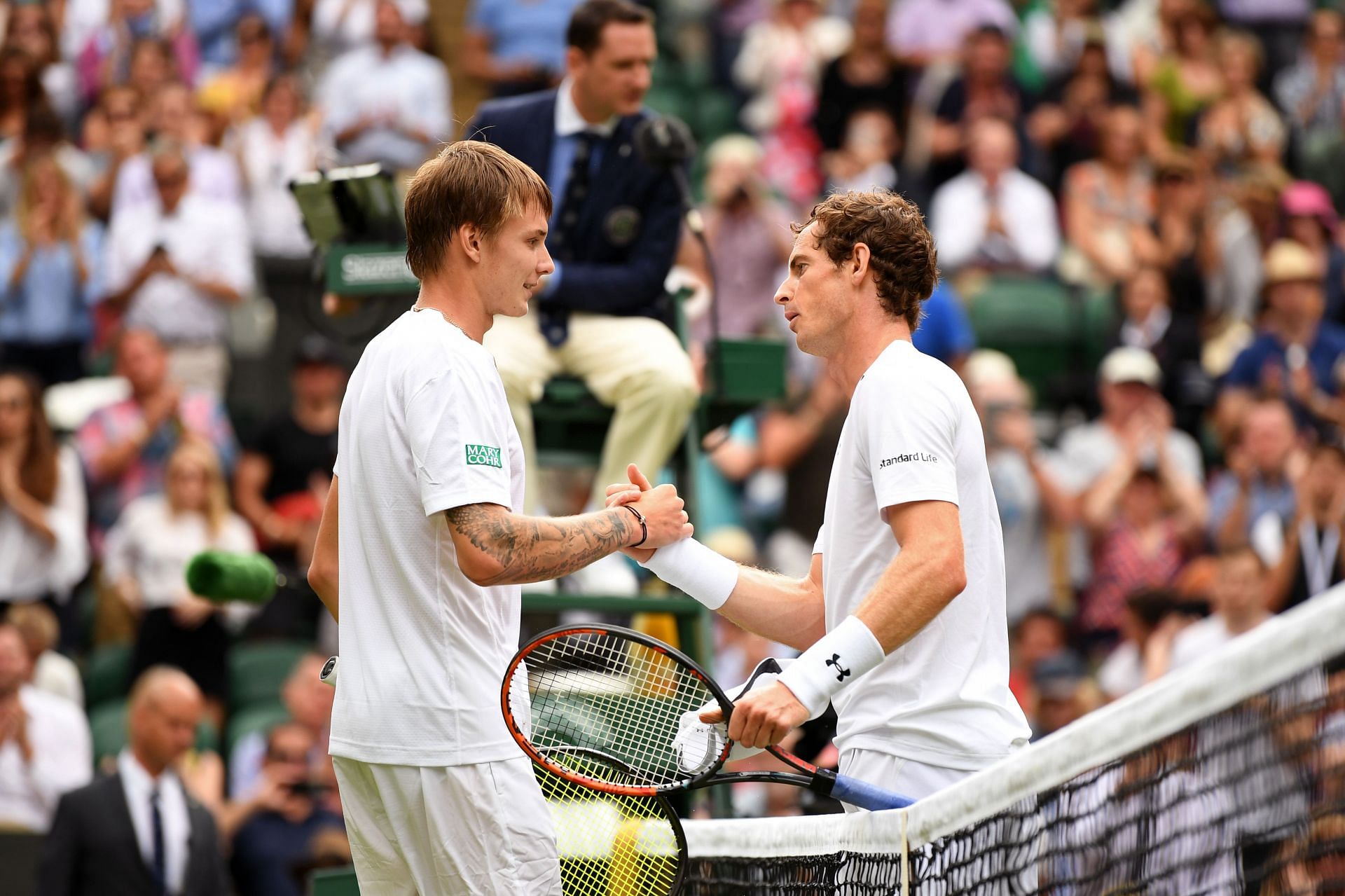 Alexander Bublik and Andy Murray shake hands after their match at the 2017 Wimbledon Championships