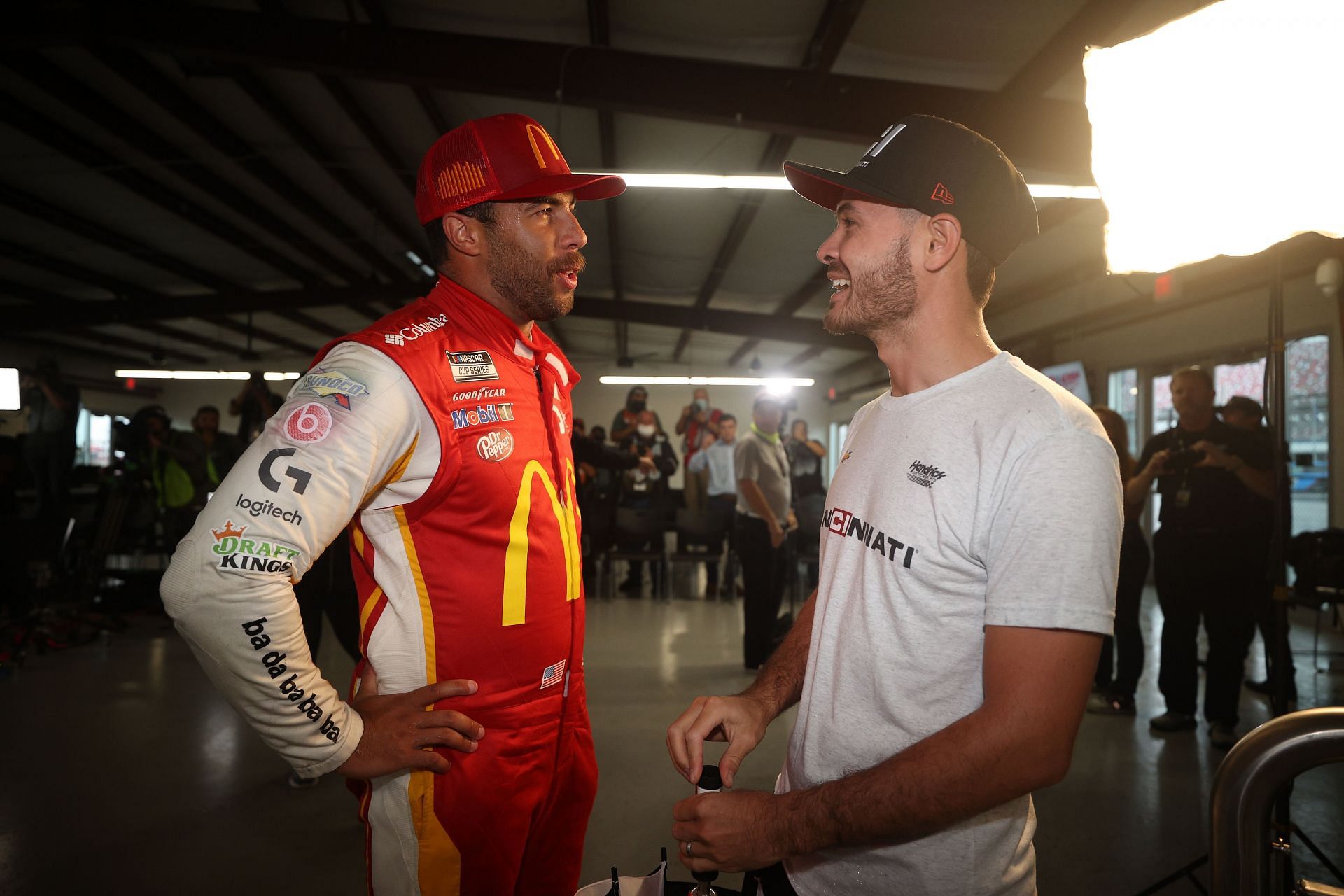 Bubba Wallace Jr. (left) talks with Kyle Larson (right) in the victory lane after the NASCAR Cup Series YellaWood 500 (Photo by Chris Graythen/Getty Images)