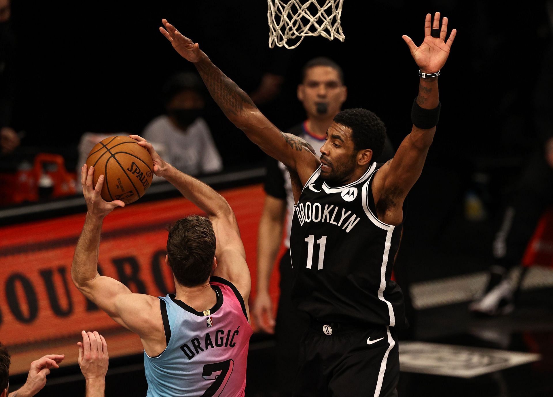Goran Dragic (left) tries to score a layup against Kyrie Irving