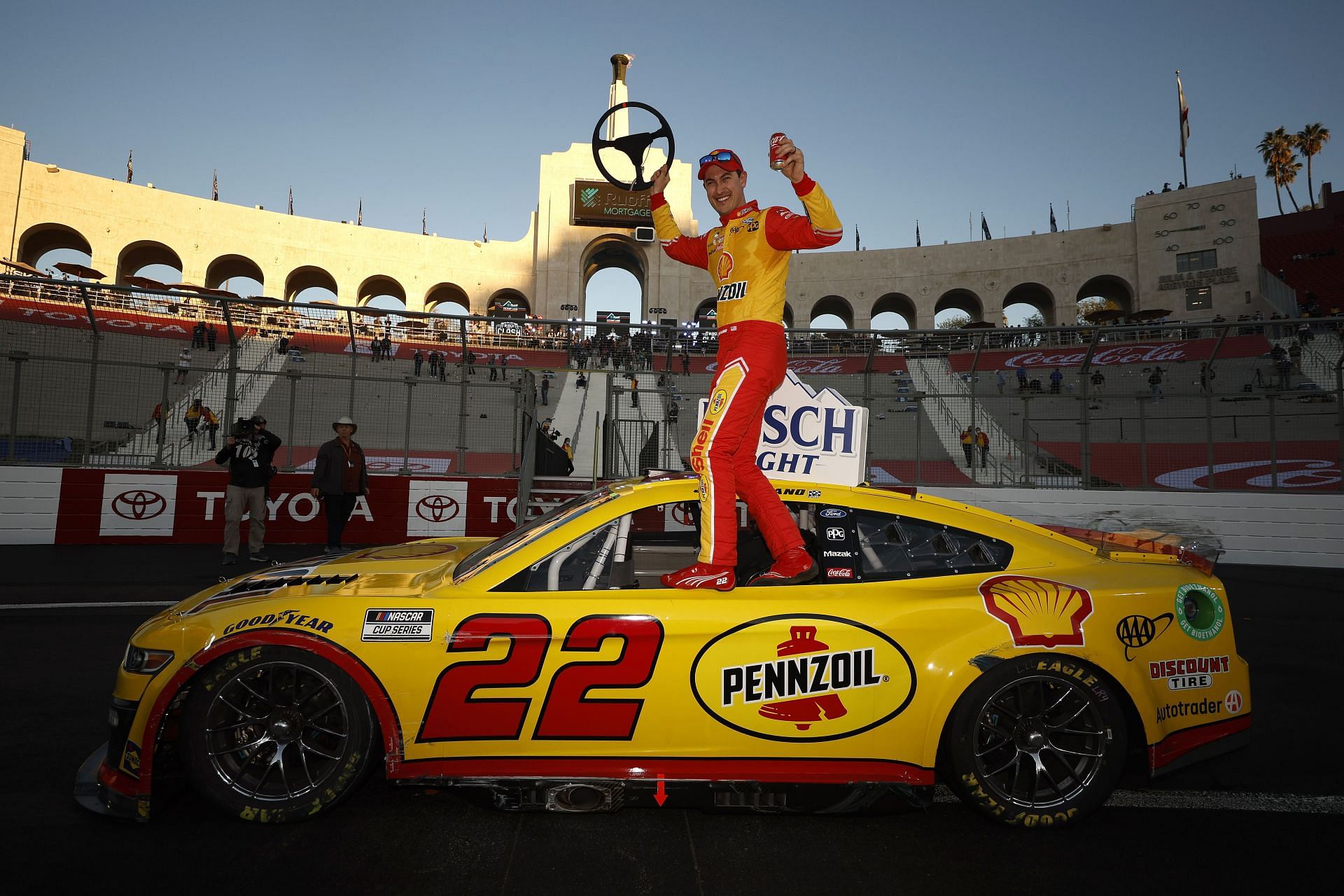 Joey Logano strikes a pose after winning the NASCAR Cup Series Busch Light Clash (Photo by Chris Graythen/Getty Images)