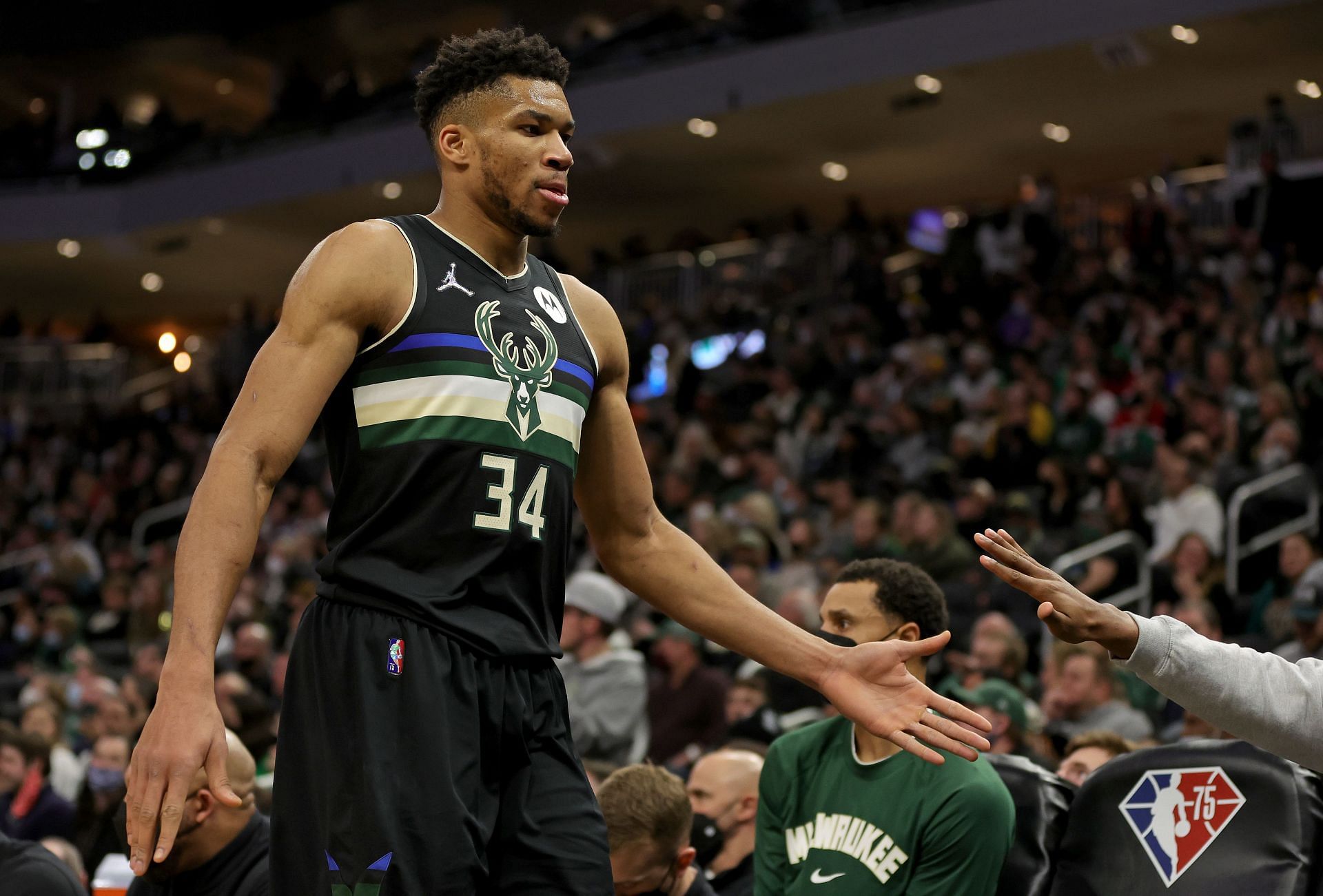 Giannis Antetokounmpo #34 of the Milwaukee Bucks walks to the bench during the fourth quarter against the New York Knicks at Fiserv Forum on January 28, 2022 in Milwaukee, Wisconsin.