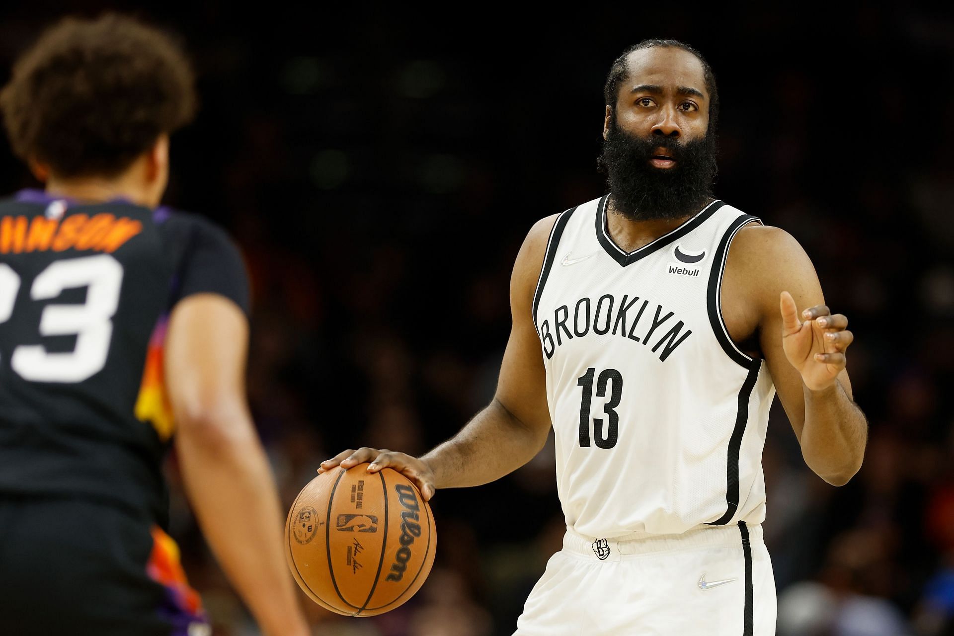James Harden of the Brooklyn Nets handles the ball against the Phoenix Suns.