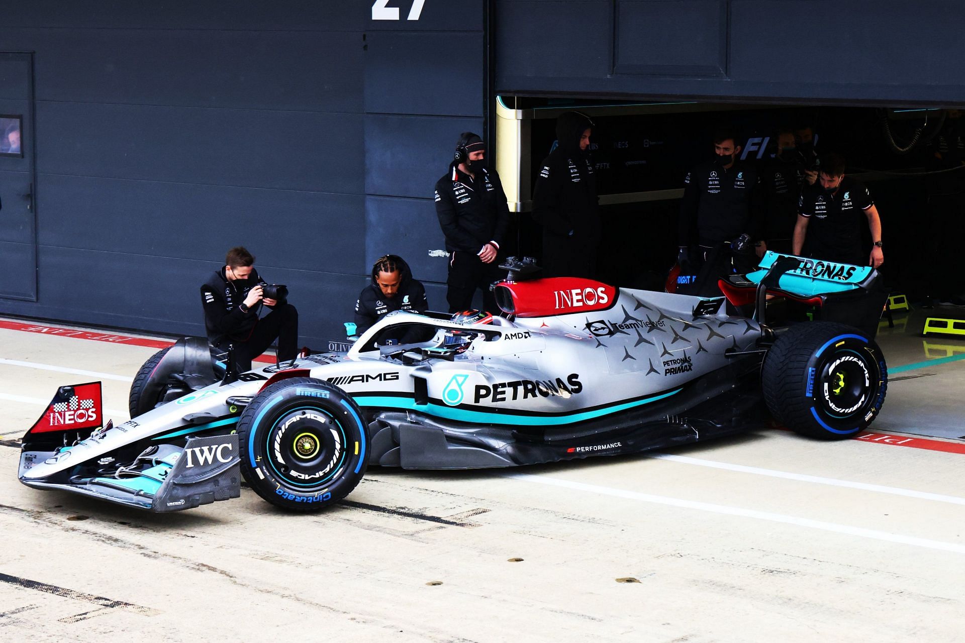 Lewis Hamilton watches on as George Russell takes the Mercedes W13 out for the first shakedown (Image Courtesy: @MercedesAMGF1 on Twitter