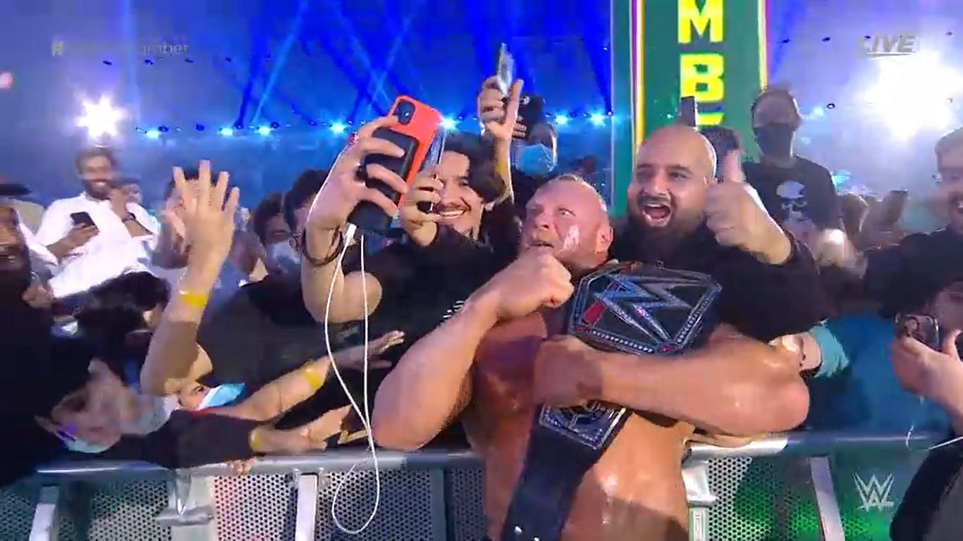 Lesnar celebrates his WWE title win with fans