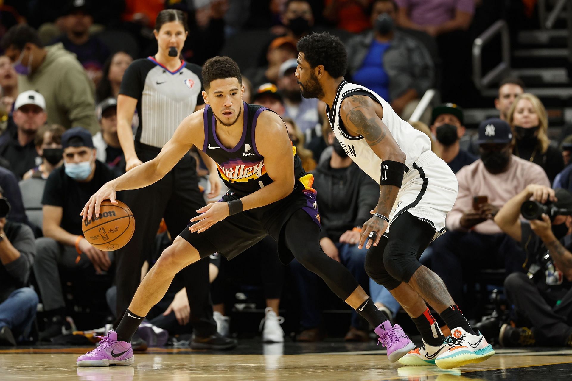 Devin Booker goes to work against Kyrie Irving.