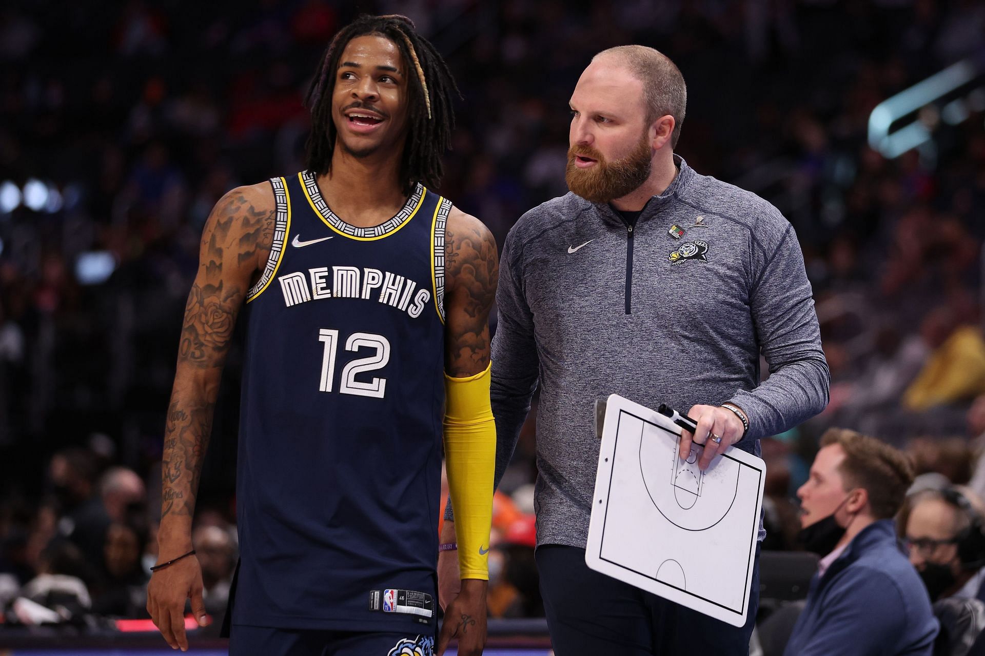 Ja Morant of the Memphis Grizzlies talks with coach Taylor Jenkins