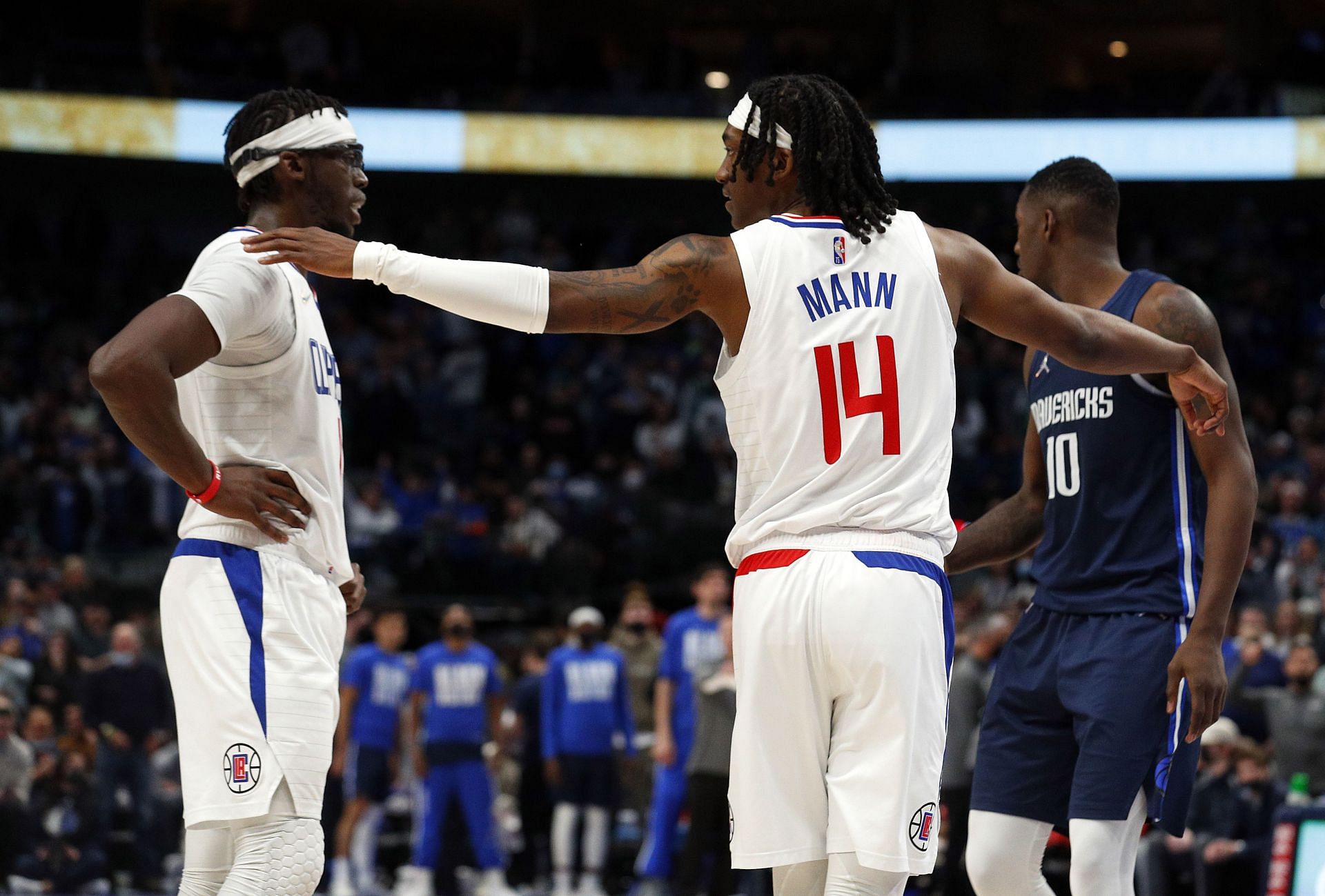 Reggie Jackson and Terance Mann of the LA Clippers against the Dallas Mavericks