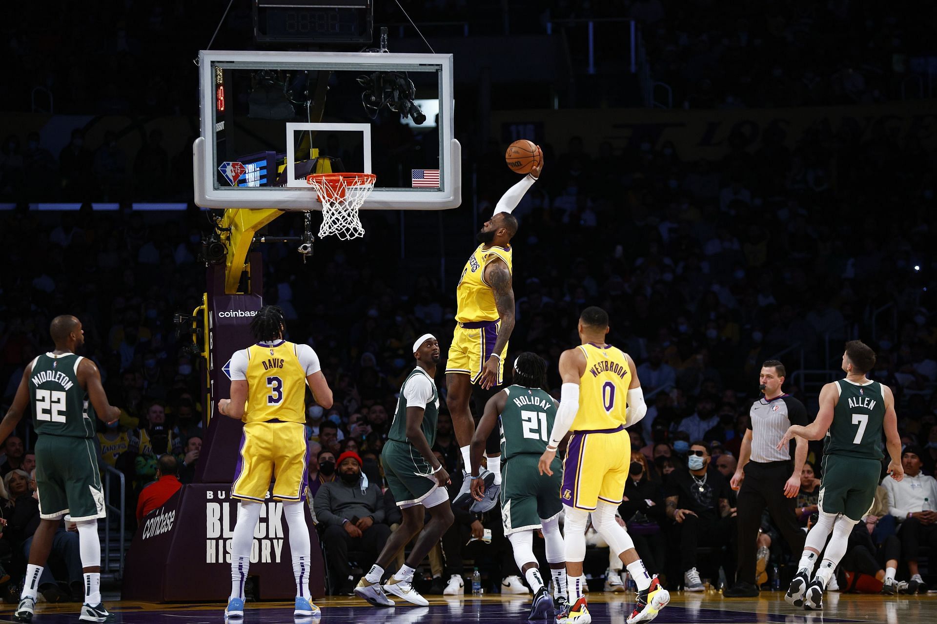 LeBron James #6 of the Los Angeles Lakers makes a slam dunk against the Milwaukee Bucks