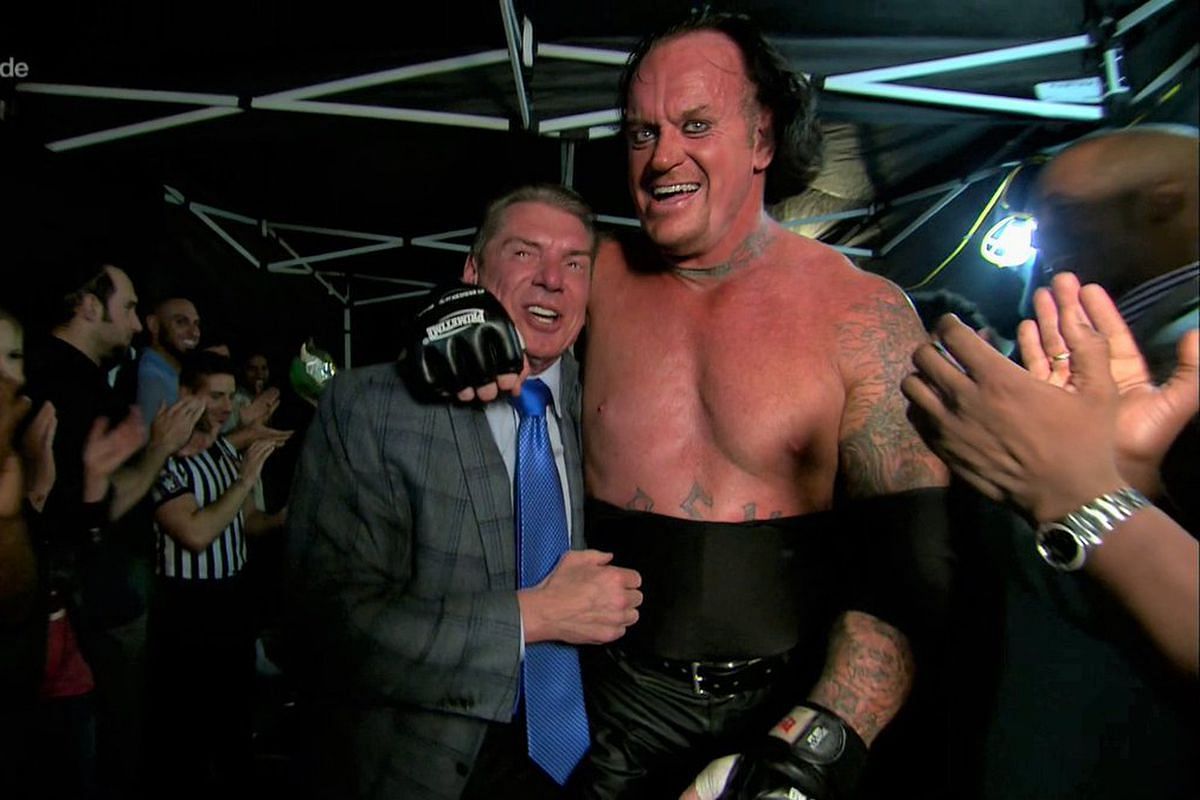 Vince McMahon and The Undertaker backstage after a match.