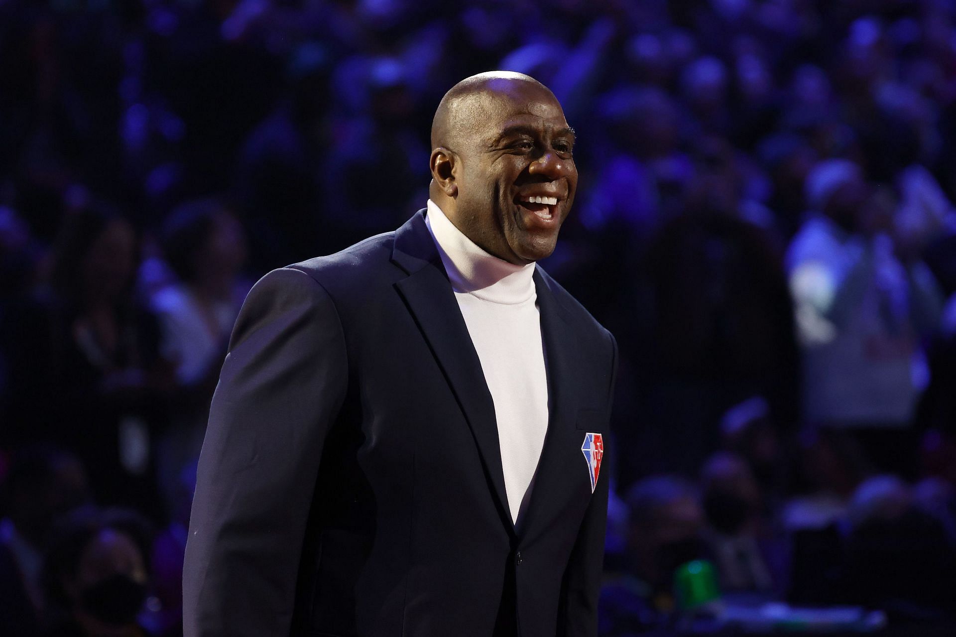 Earvin &quot;Magic&quot; Johnson reacts after being introduced as part of the NBA&#039;s 75th Anniversary Team at the All-Star Game on Sunday.