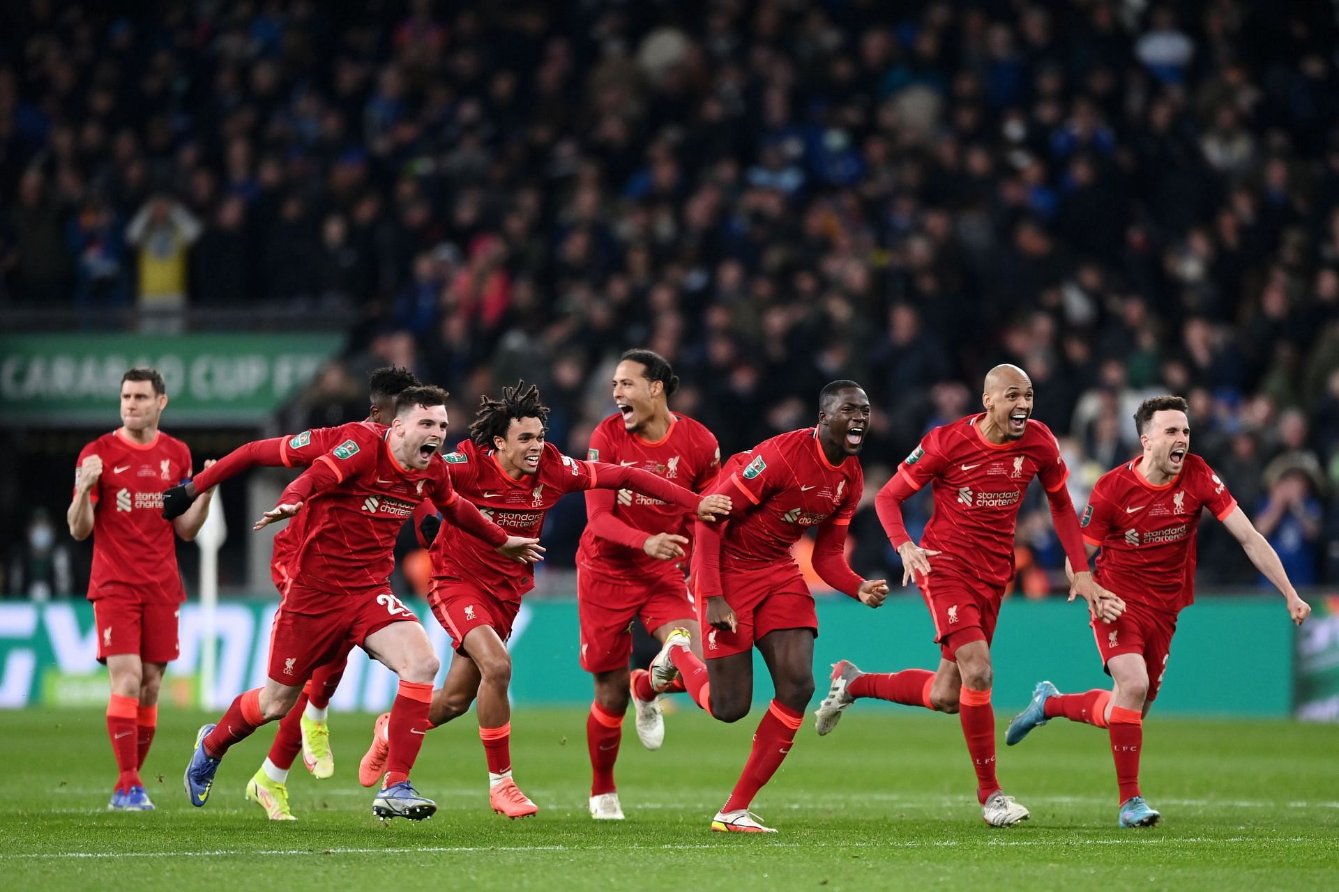 Liverpool players jubilant after winning the penalty shootout in the League Cup final against Chelsea