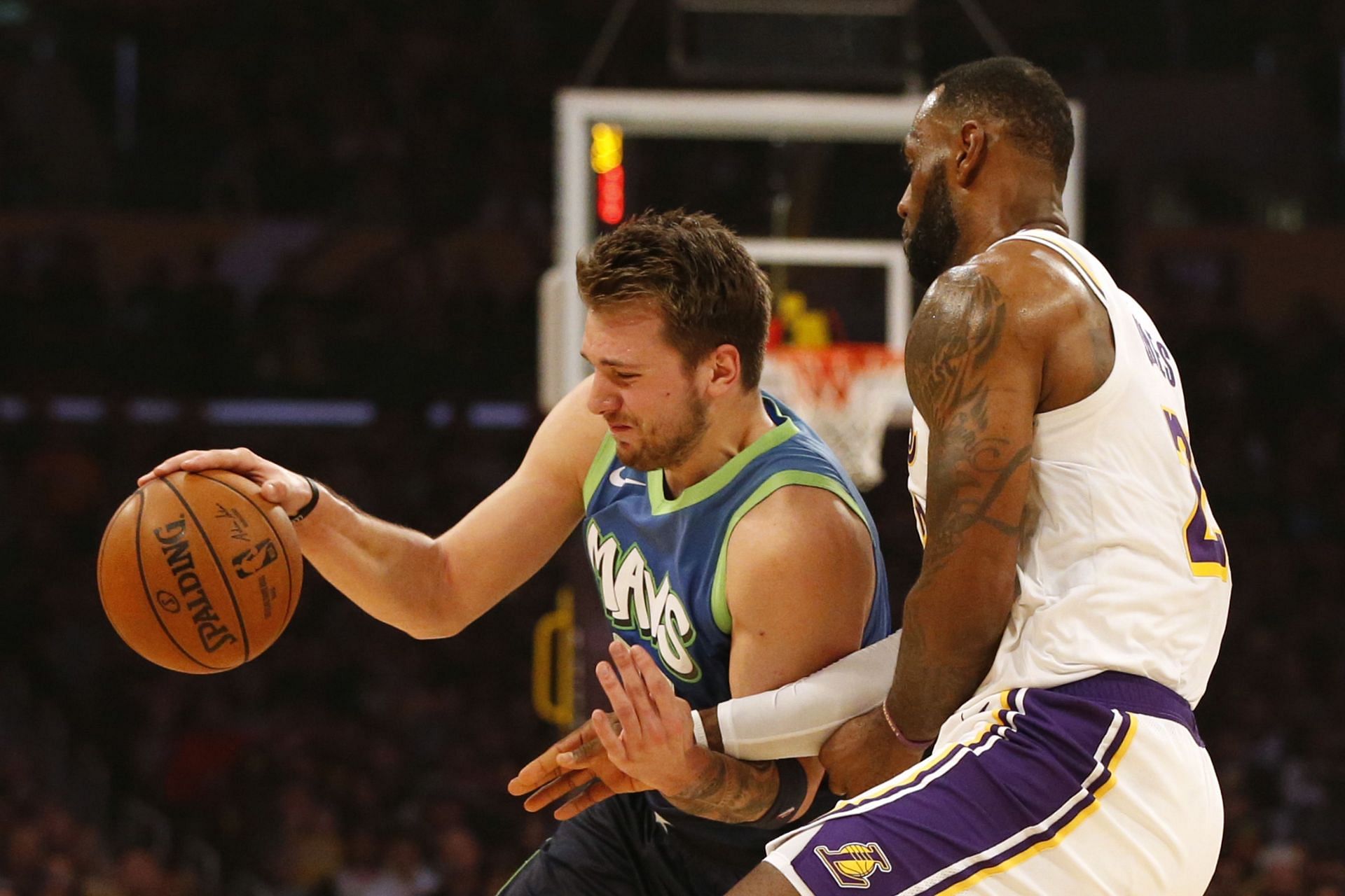 Luka Doncic (left) and Lebron James in action during Dallas Mavericks vs LA Lakers game.