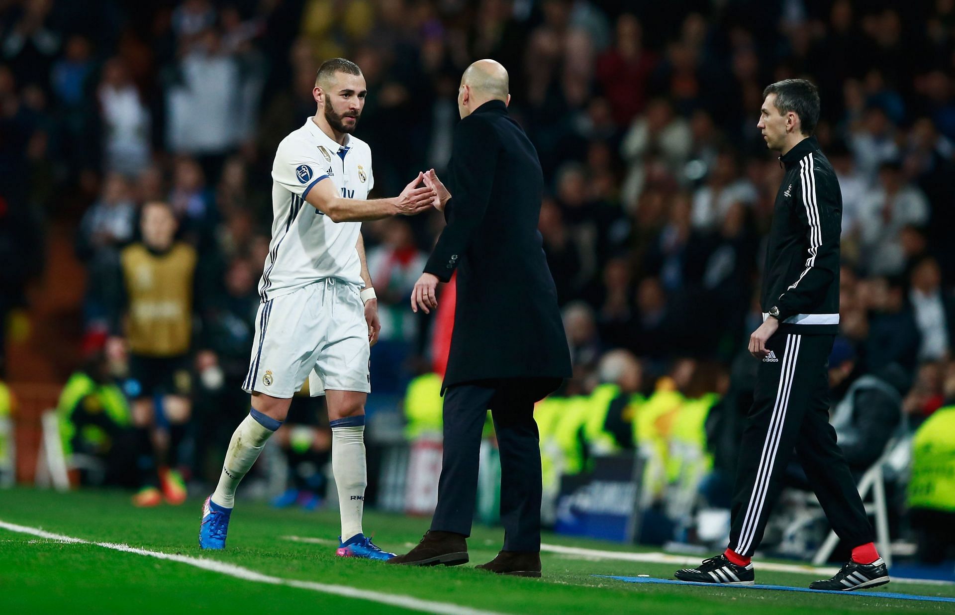 Karim Benzema (L) greets Zidane after being subbed off.