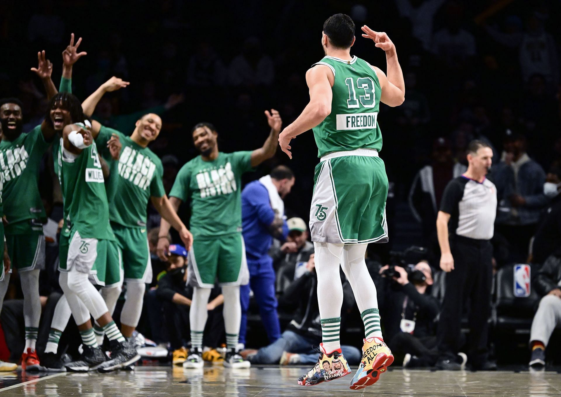 The Boston Celtics celebrate a made three-point shot