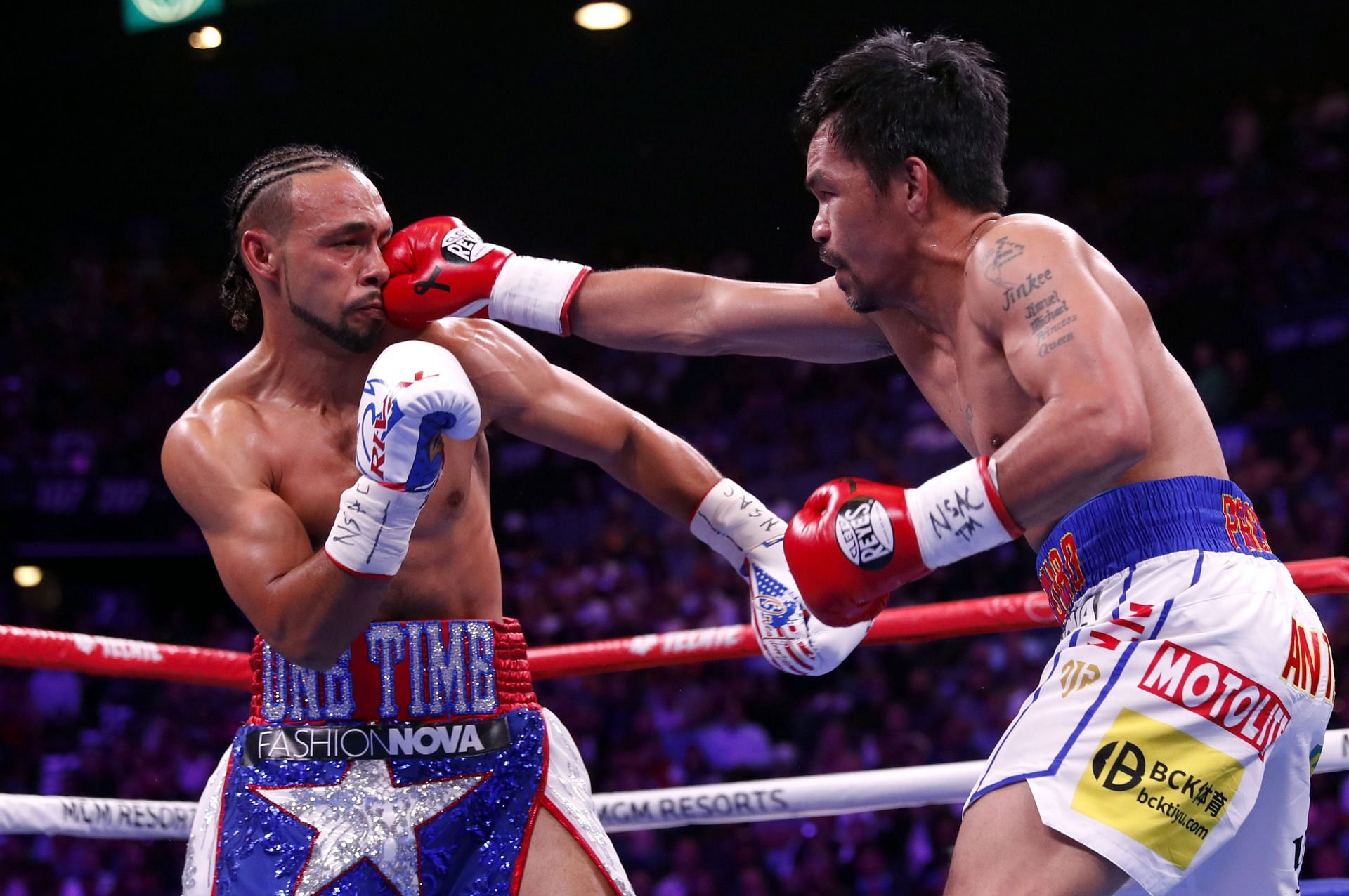 Keith Thurman (L) has given his assessment of his 2019 loss to Manny Pacquiao (R)