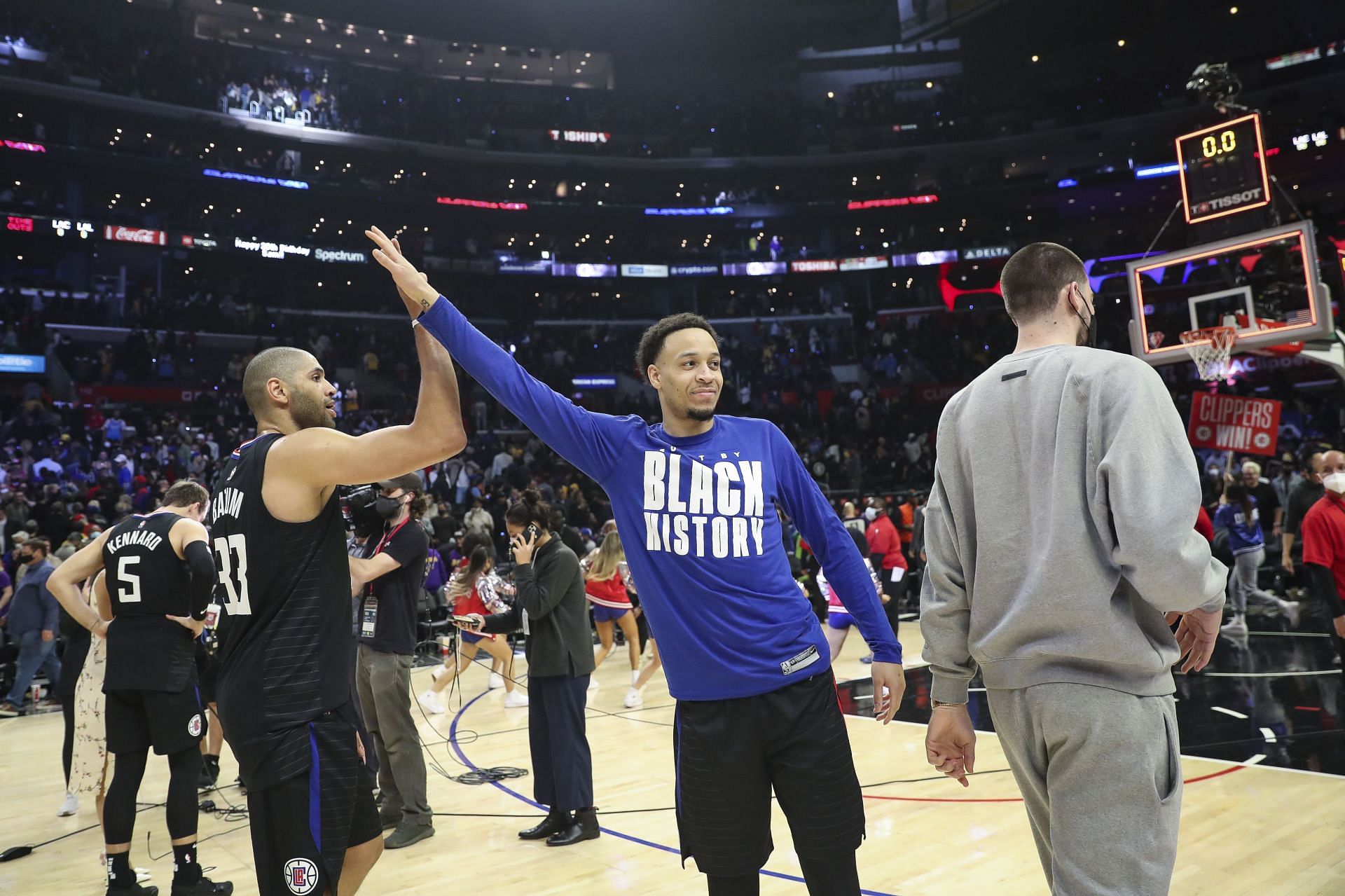 Amir Coffey #7 and Nicolas Batum #33 of the LA Clippers celebrate after defeating the Los Angeles Lakers 111-110 at Crypto.com Arena