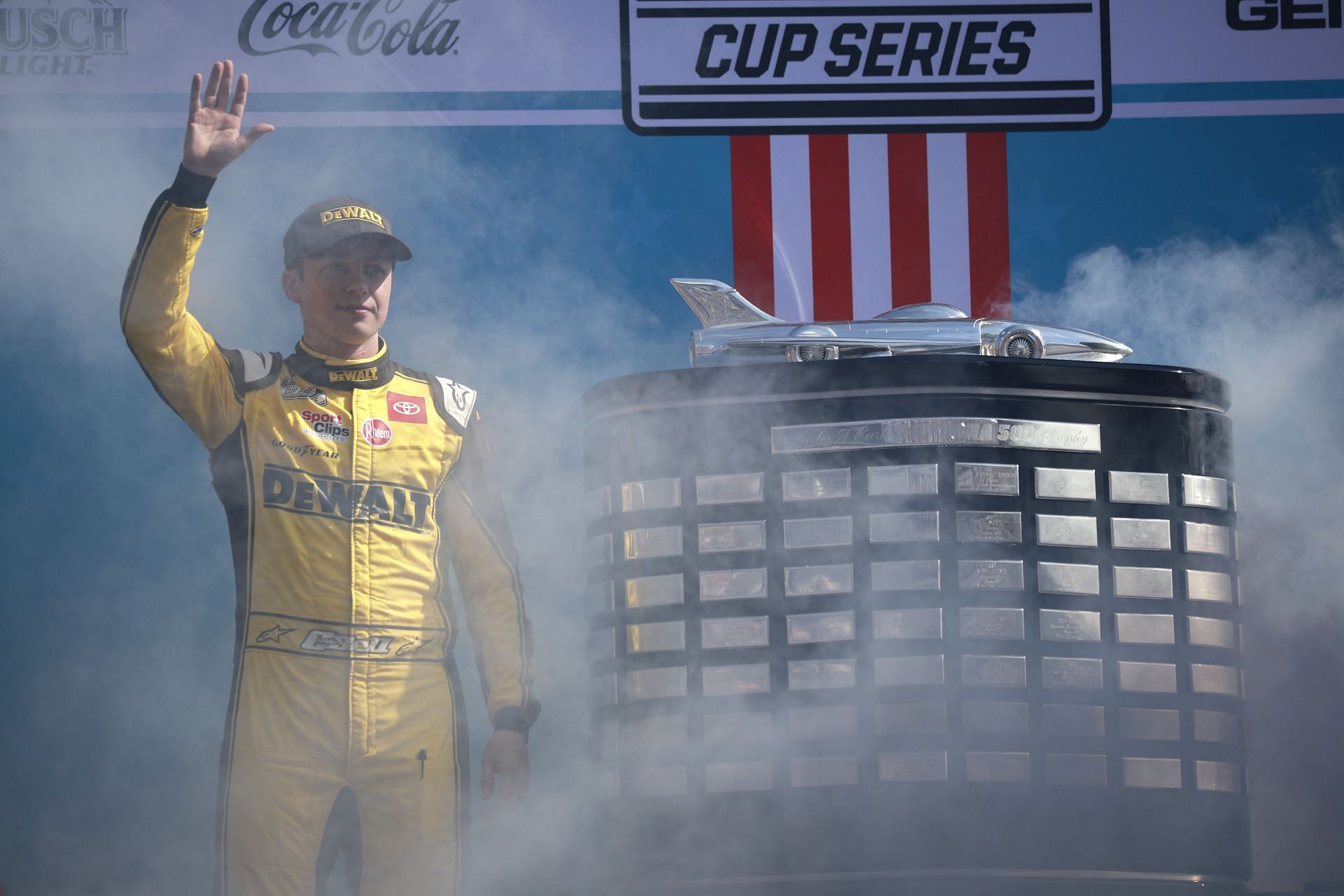 Christopher Bell waves to fans onstage during the driver intros before the 64th annual Daytona 500