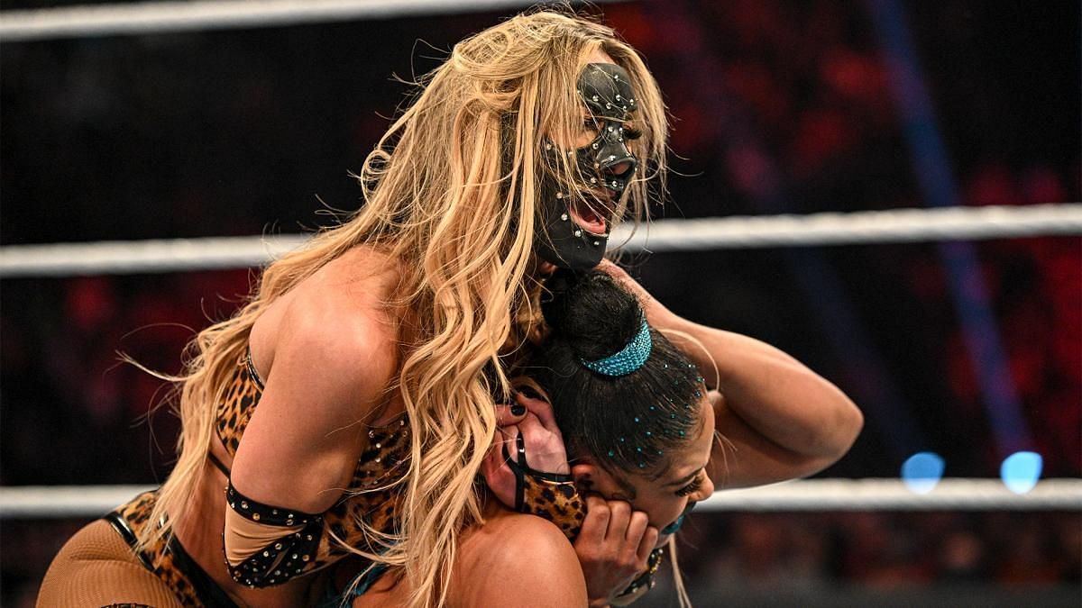 Carmella competing on WWE RAW wearing her protective mask