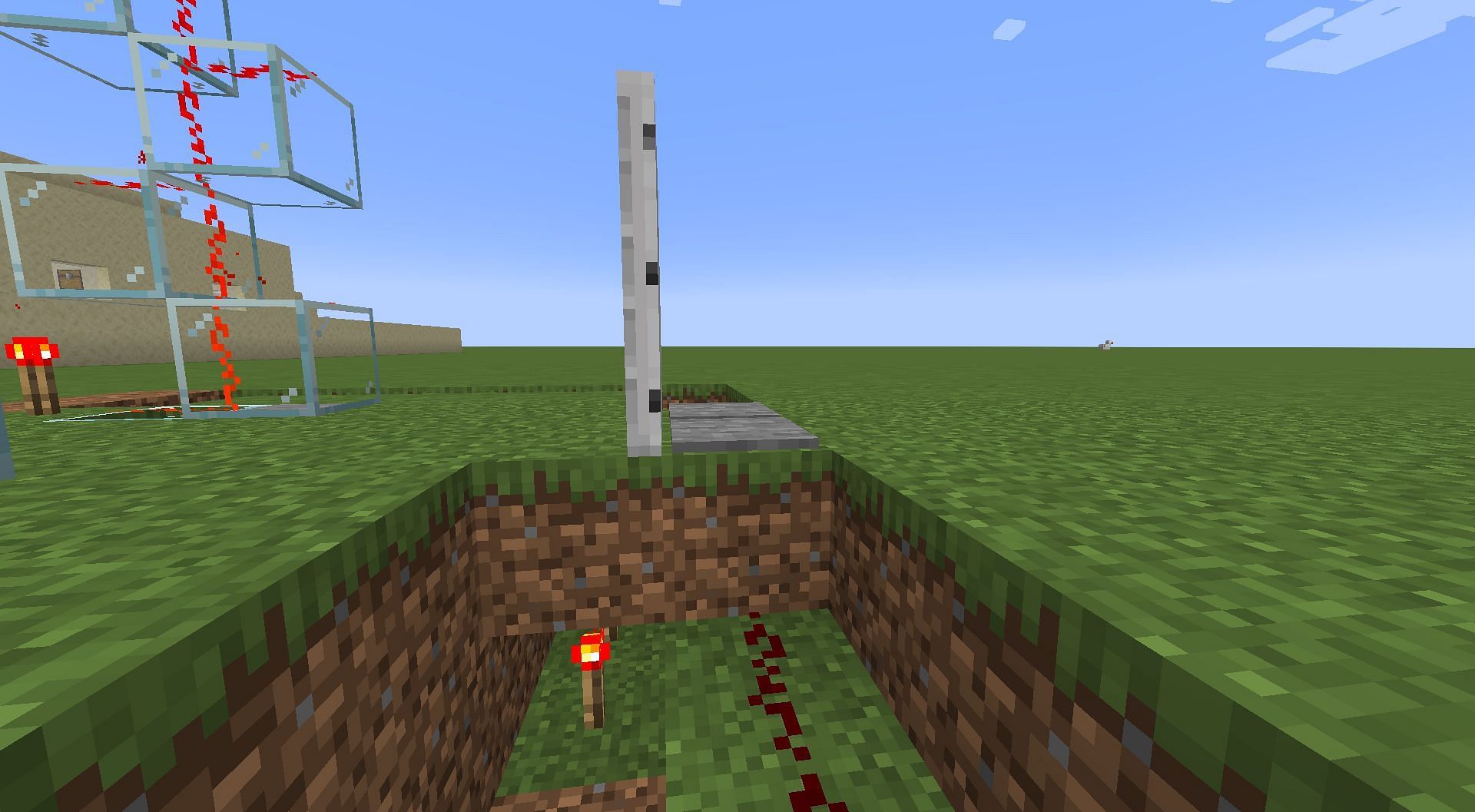 Iron doors activated with redstone torch (Image via Minecraft)