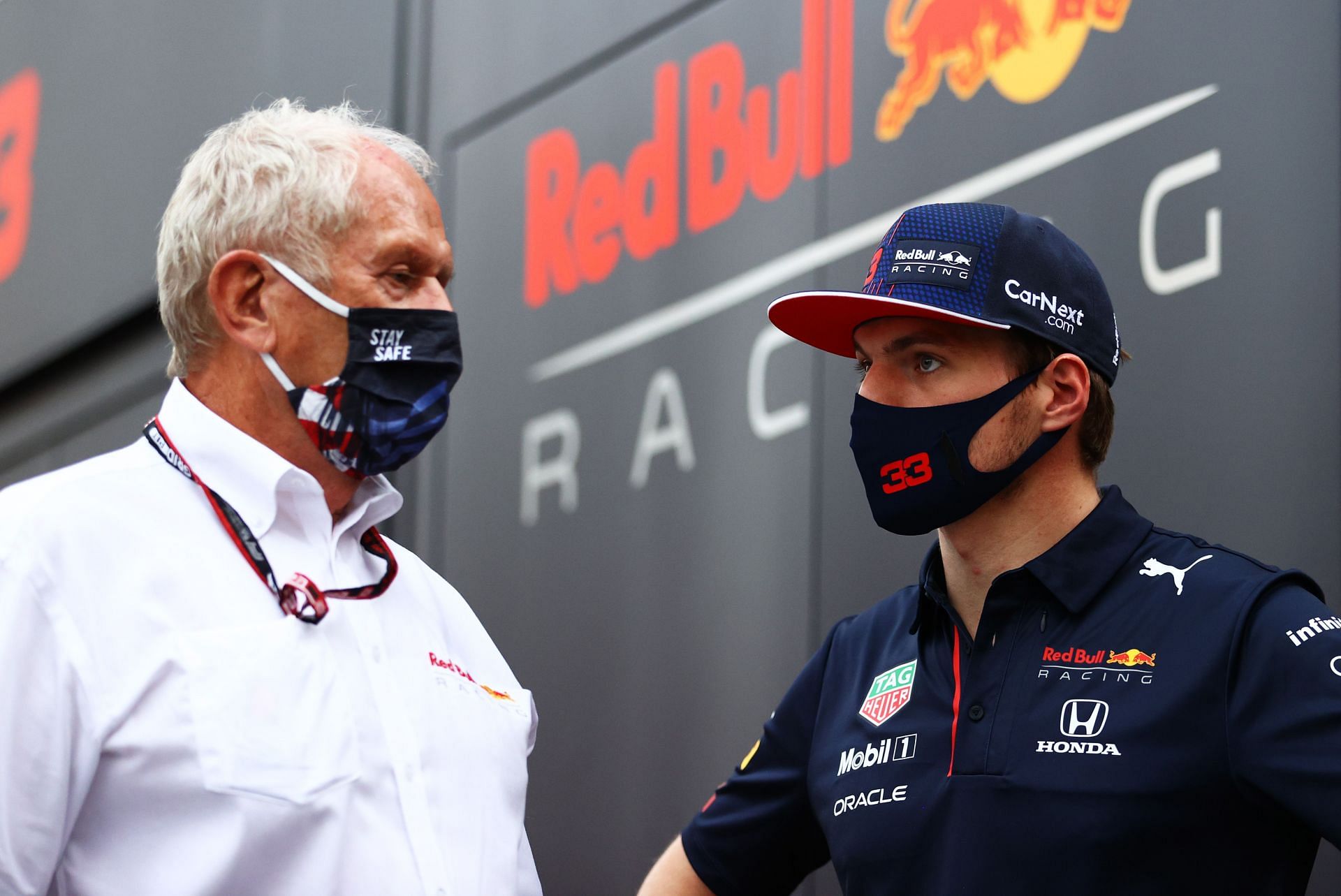 Max Verstappen talks with Red Bull Racing Team Consultant Dr Helmut Marko in the Paddock in Monza, Italy. (Photo by Bryn Lennon/Getty Images)