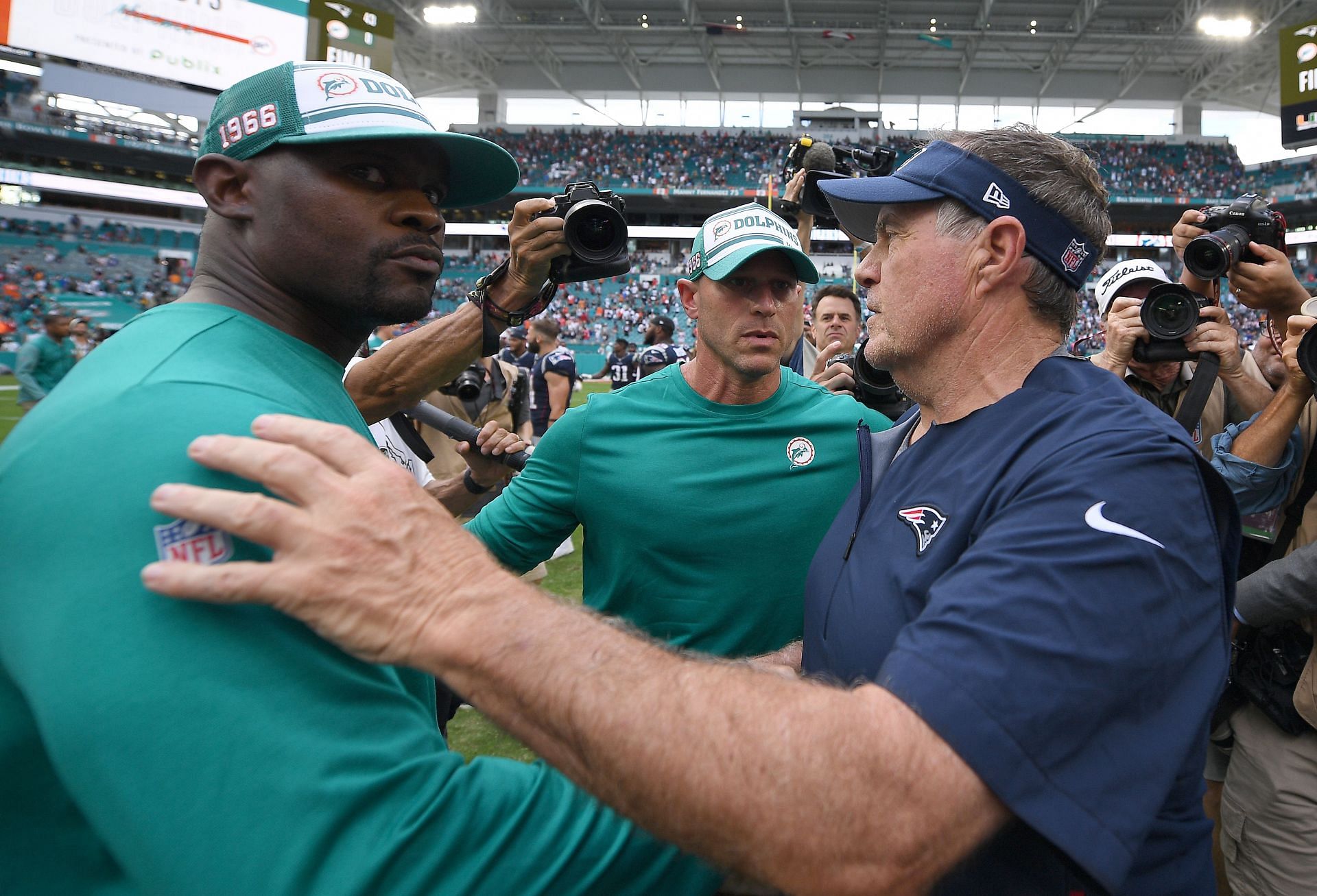 Patriots HC Bill Belichick and former Dolphins HC Brian Flores