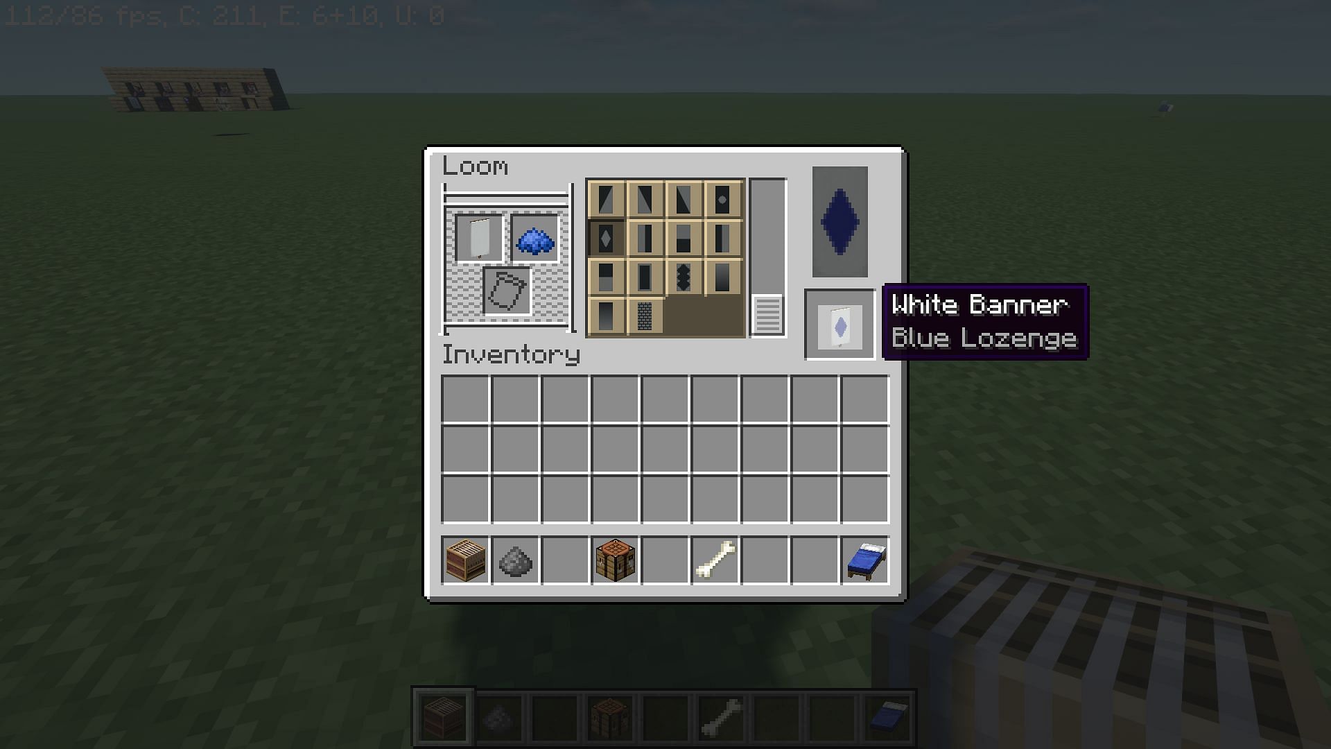 Designing banners on a loom (Image via Minecraft)