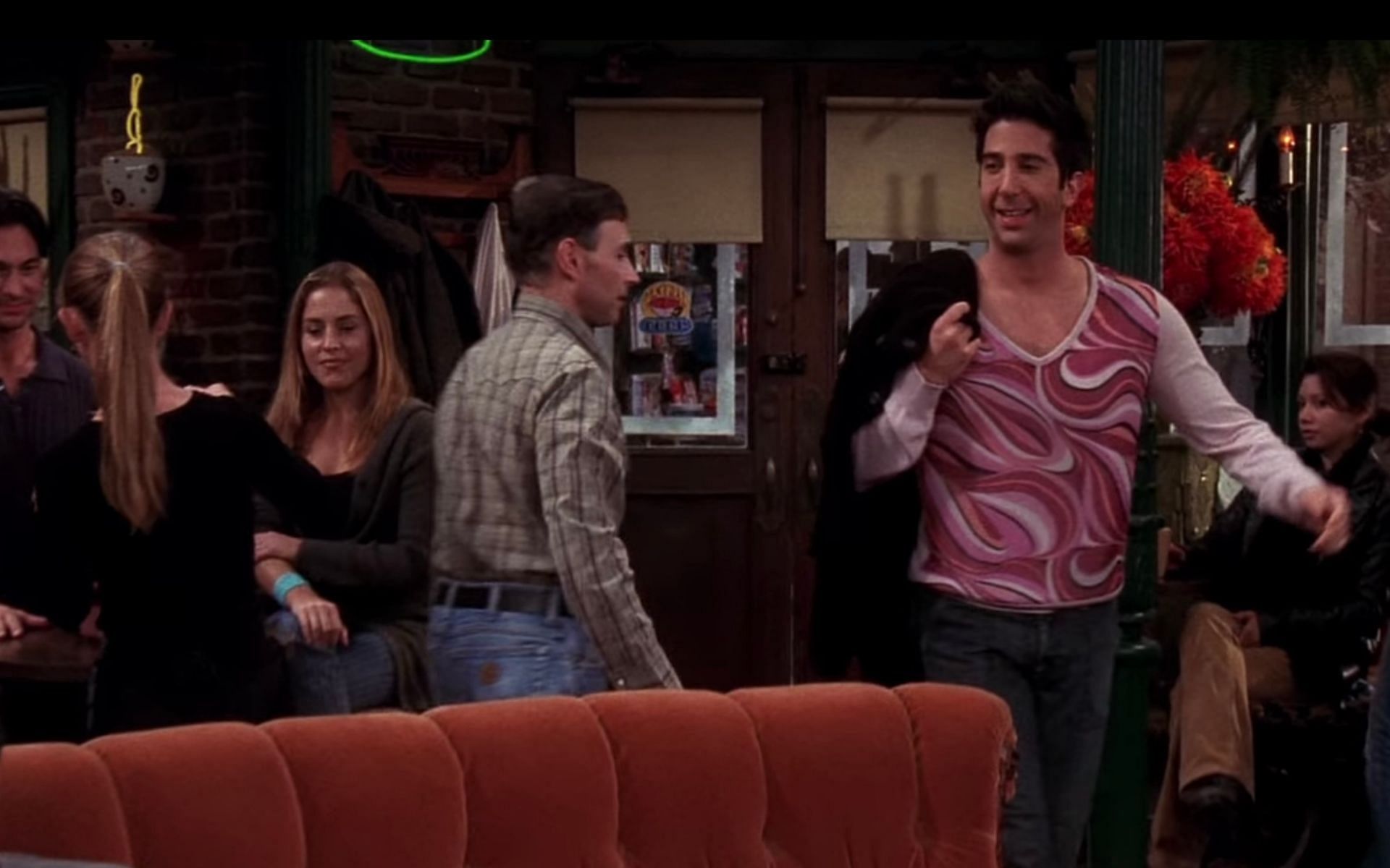 Ross Geller in a pink women&#039;s sweater (Image via Netflix)