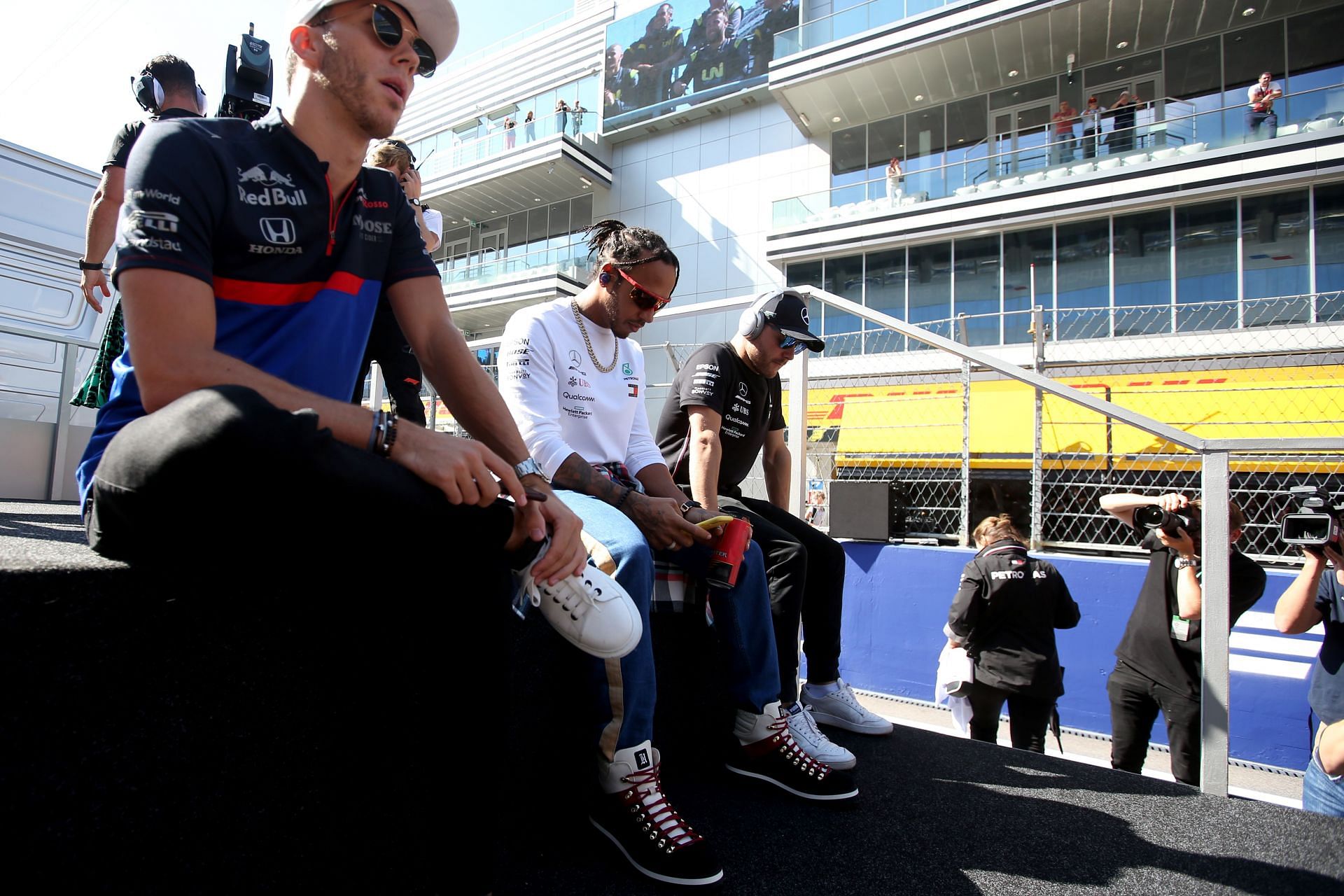 Pierre Gasly (left) and Lewis Hamilton (center) at the 2019 Russian Grand Prix (Photo by Charles Coates/Getty Images)