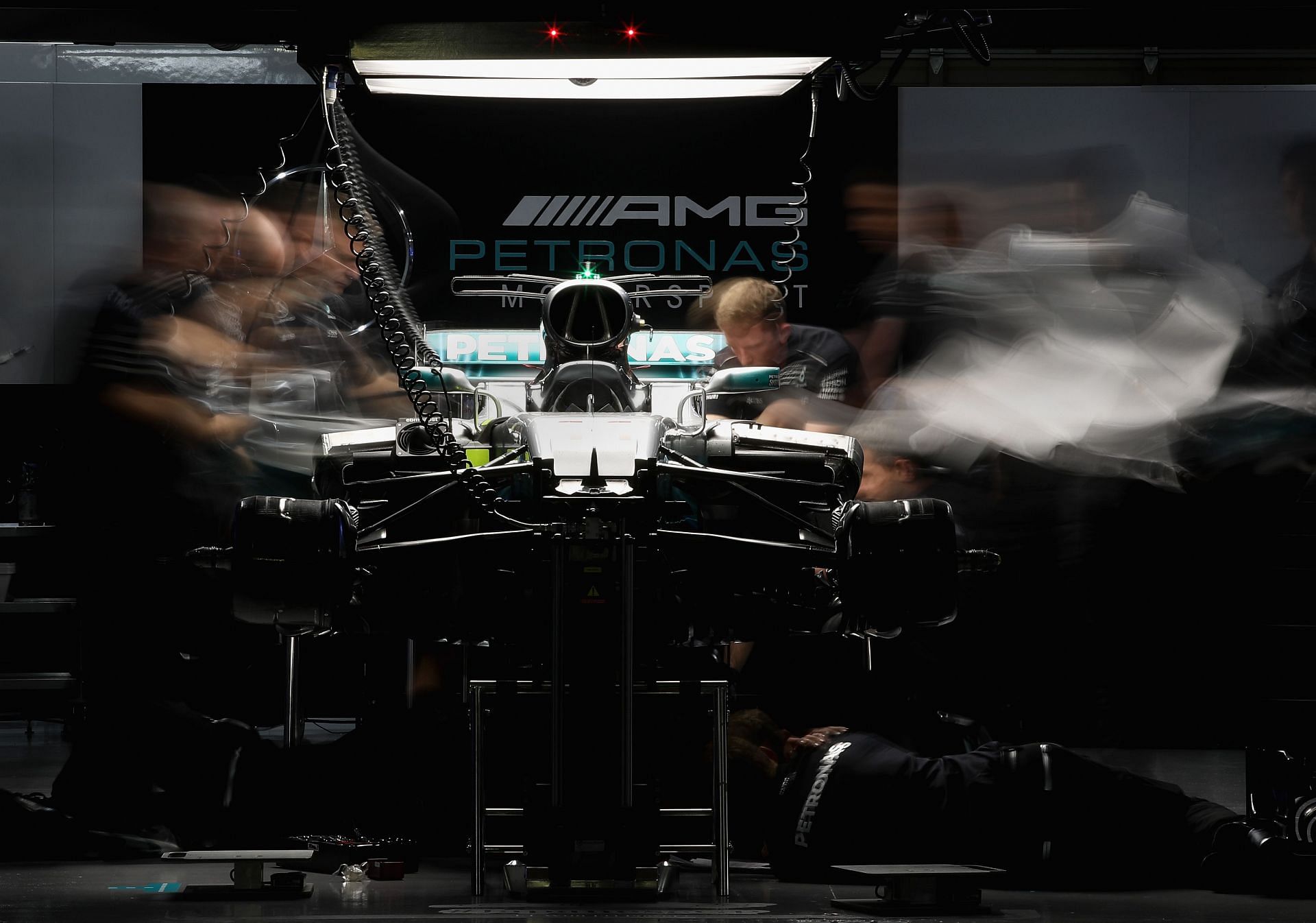 Mercedes engineers work on Lewis Hamilton&#039;s car before the 2017 Japanese Grand Prix (Photo by Clive Mason/Getty Images)