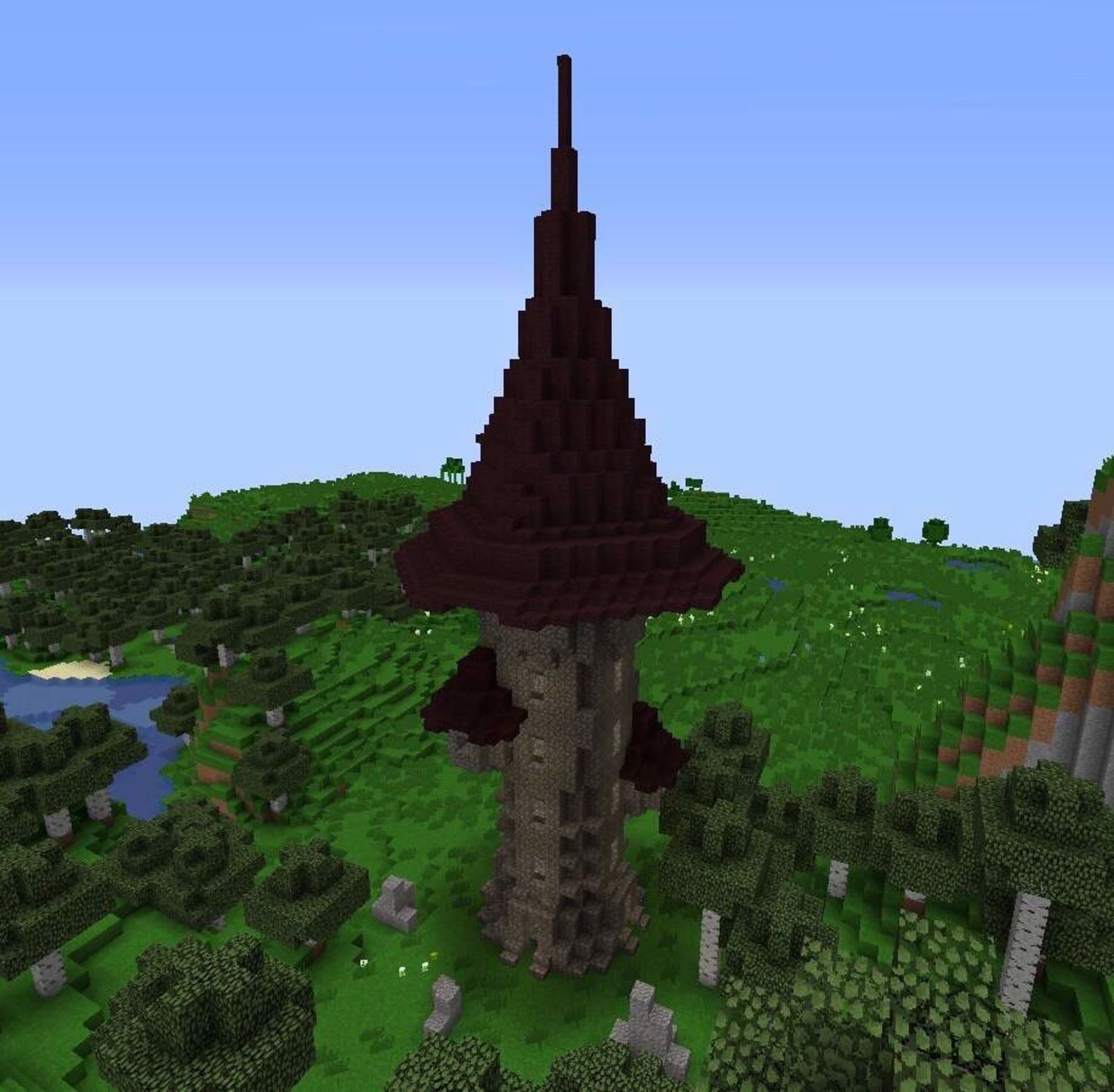 A wizard tower&#039;s central spire with various accompanying amenities (Image via Mojang Studios)