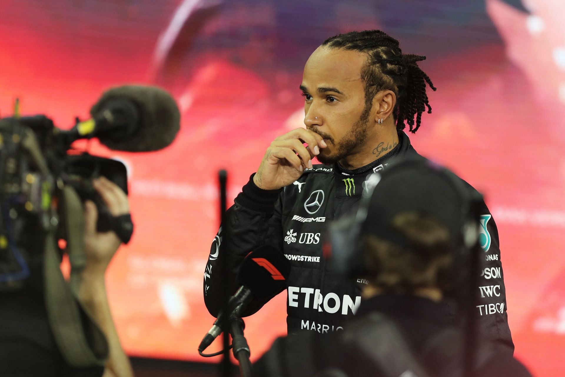 Lewis Hamilton talks to the media in parc ferme during the Abu Dhabi GP podium ceremony. (Photo by Kamran Jebreili - Pool/Getty Images)