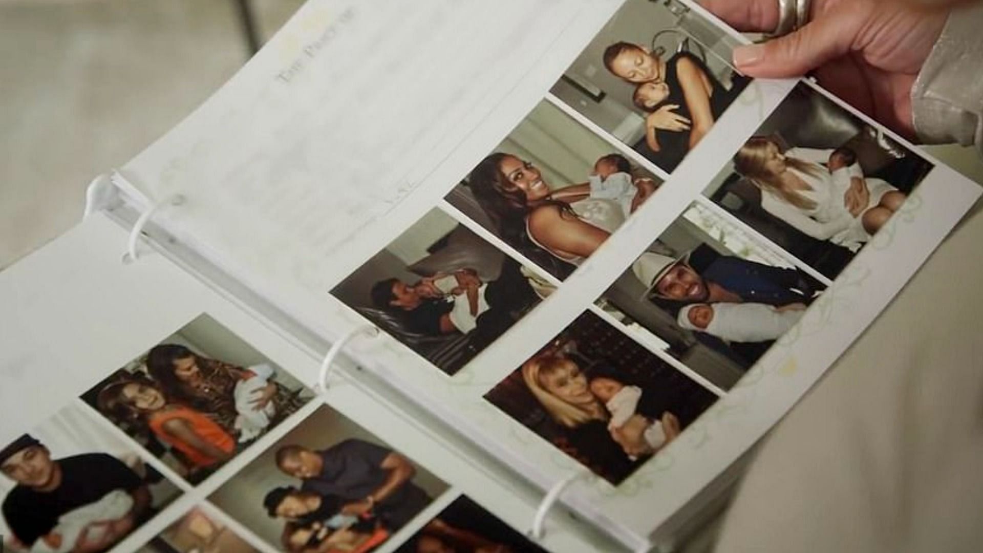 Celebrities holding baby North West, as seen in her baby book (Image via Vogue/YouTube)