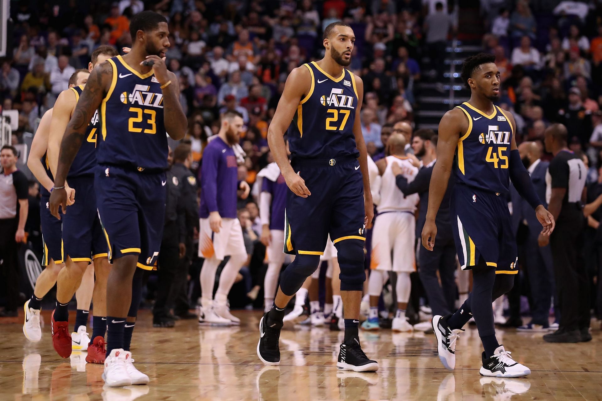 Royce O&#039;Neale #23, Rudy Gobert #27 and Donovan Mitchell #45 of the Utah Jazz during the first half of the NBA game against the Phoenix Suns at Talking Stick Resort Arena on October 28, 2019 in Phoenix, Arizona.