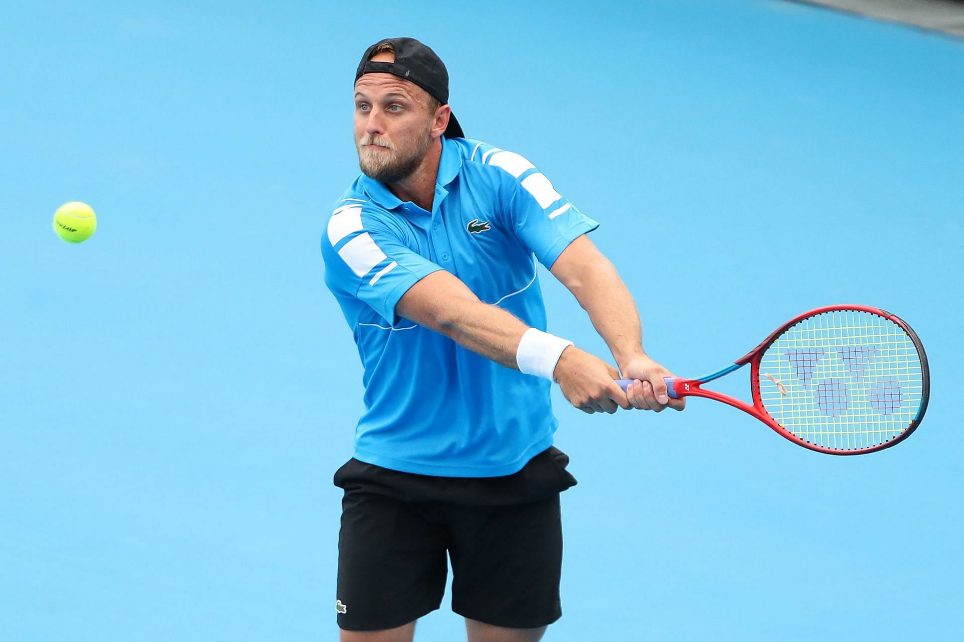 Denis Kudla hits a backhand at the 2022 Australian Open