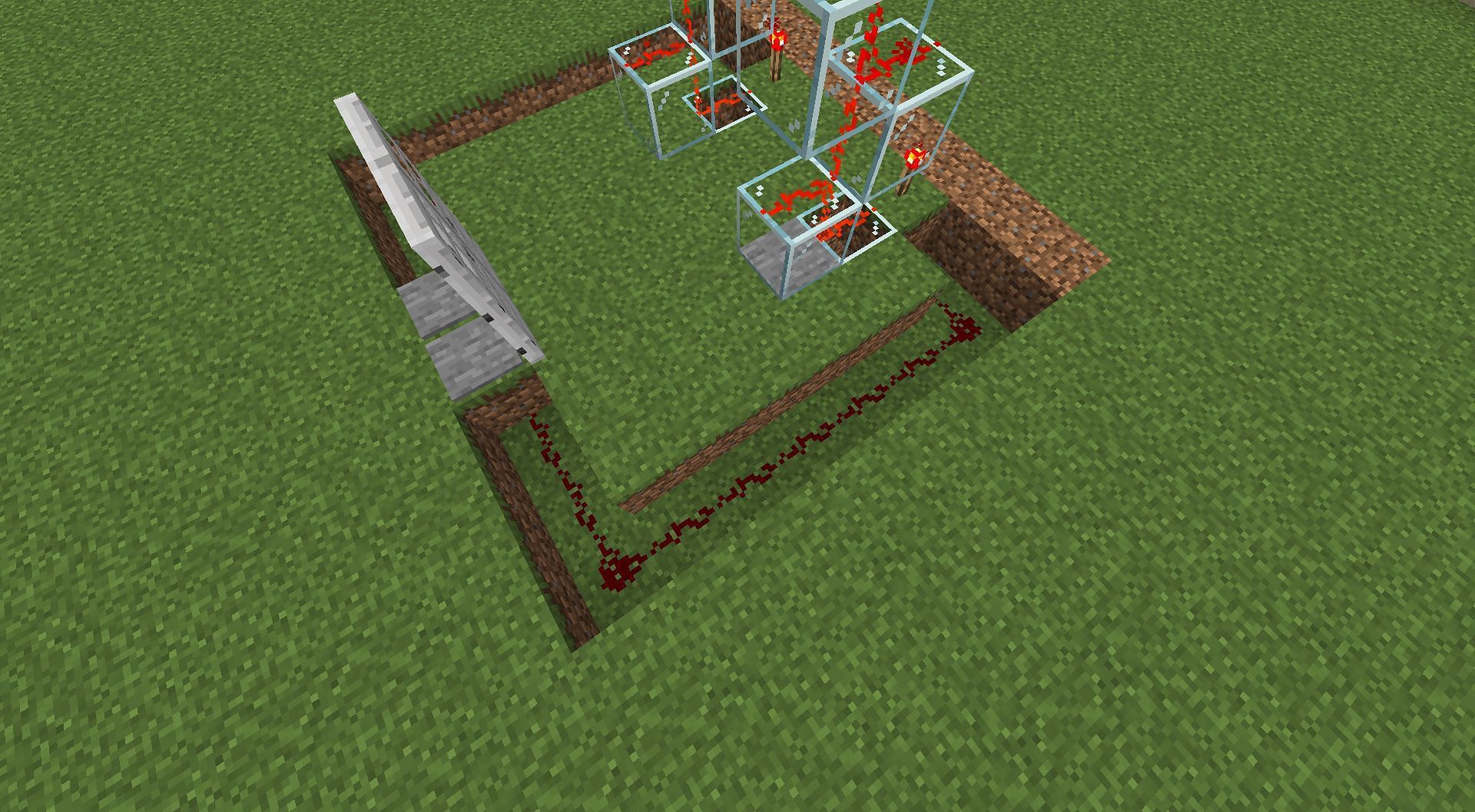 Connect the pressure plate to the piston on top (Image via Minecraft)