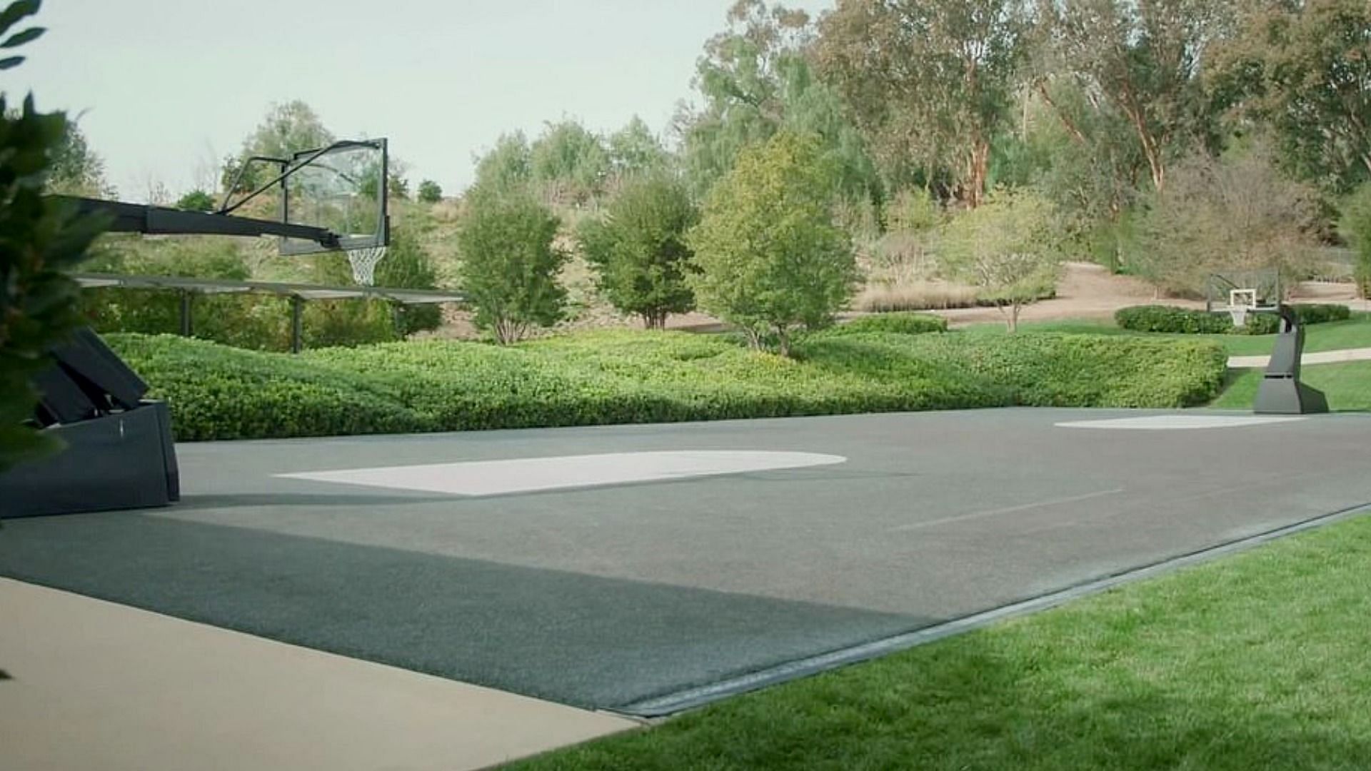 The basketball court where the children hang out, play and run around (Image via Vogue/YouTube)