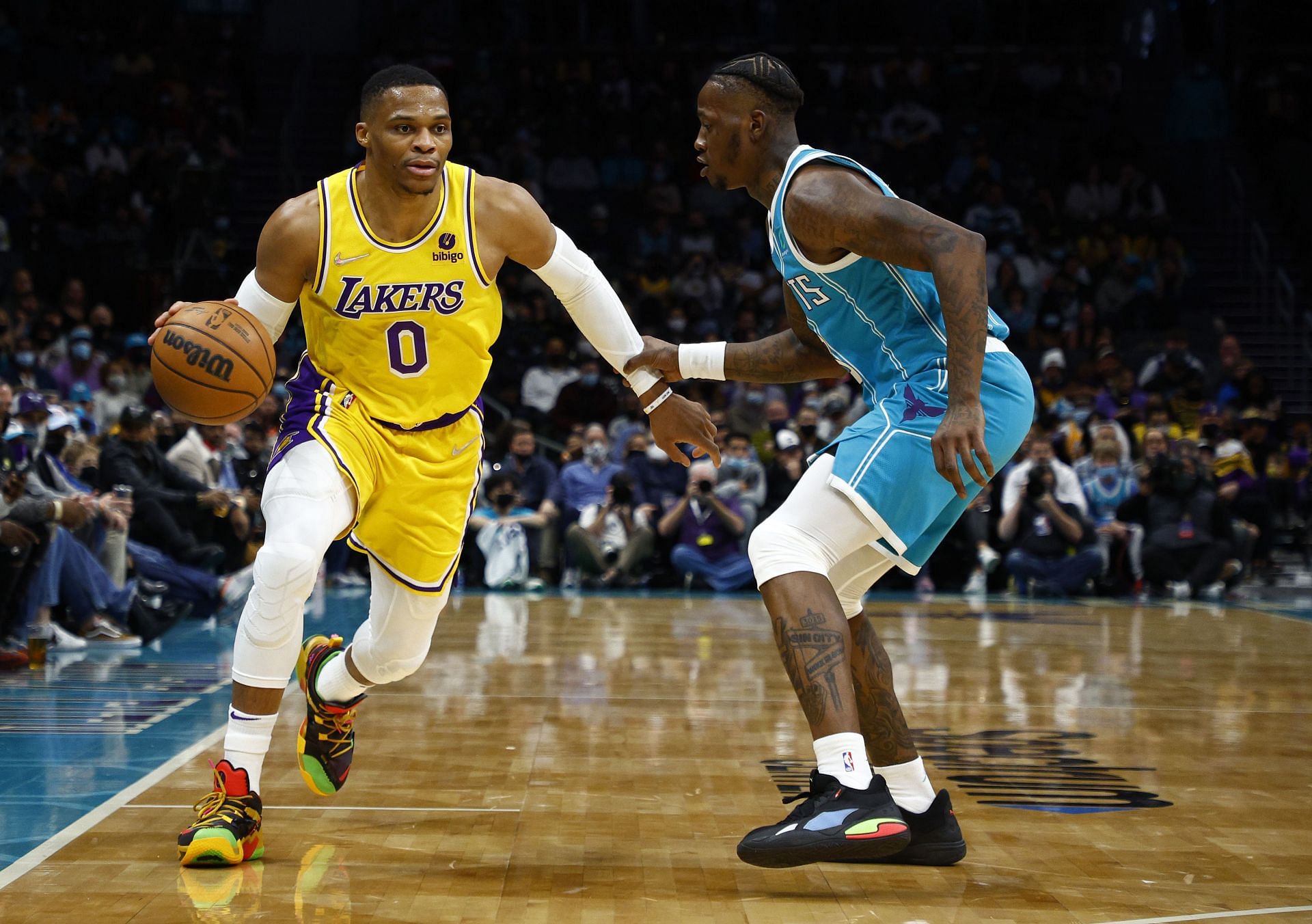 Russell Westbrook #0 of the Los Angeles Lakers dribbles against Terry Rozier #3 of the Charlotte Hornets during the first half of the game at Spectrum Center on January 28, 2022 in Charlotte, North Carolina.