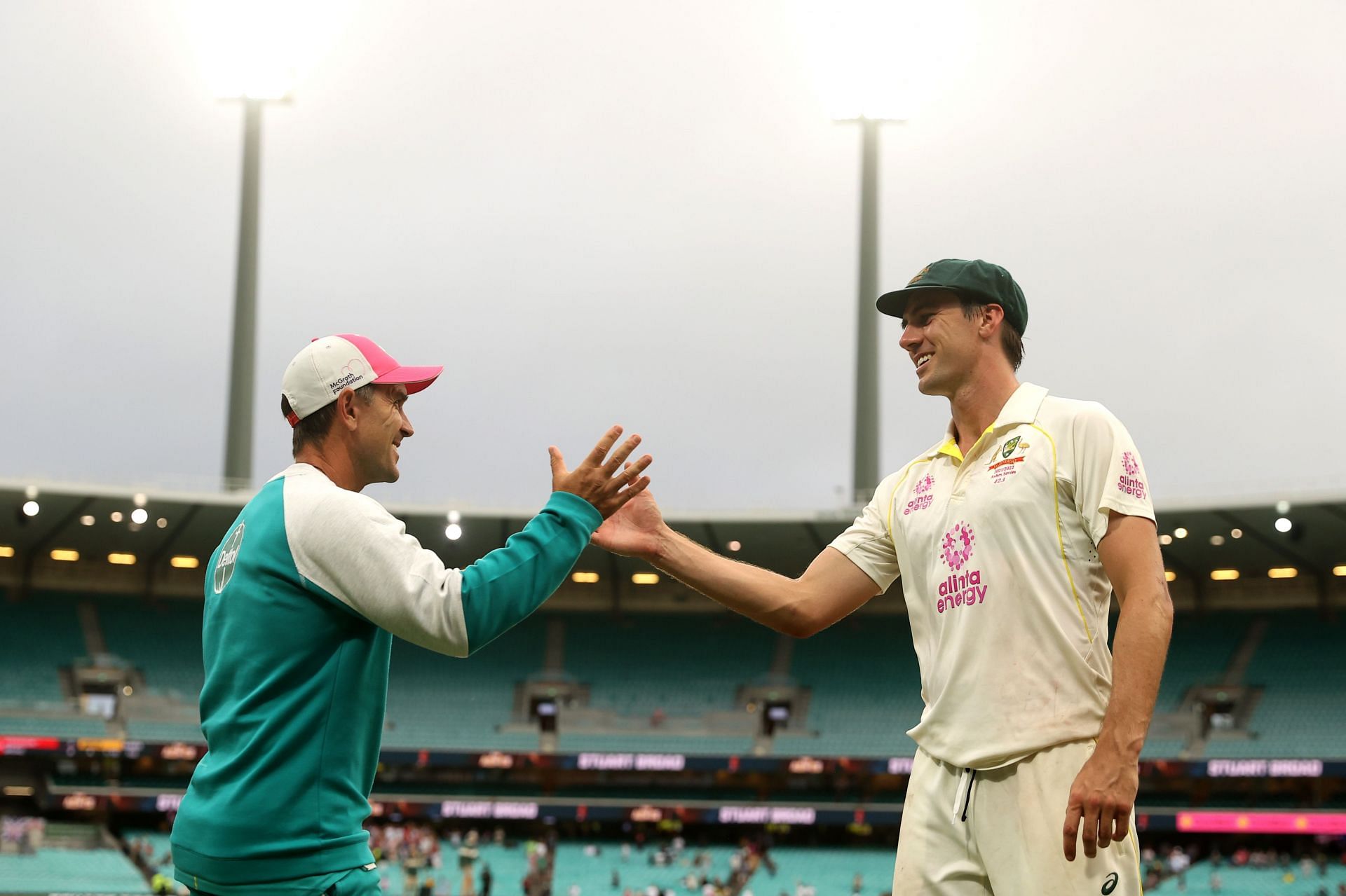 Justin Langer (left) and Pat Cummins. (Credits: Getty)