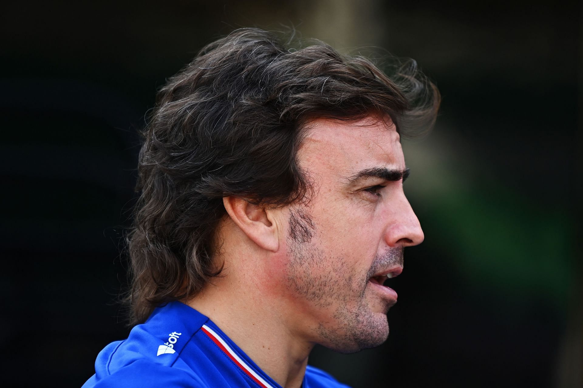 Fernando Alonso talks in the Paddock during a preview ahead of the Qatar GP. (Photo by Clive Mason/Getty Images).