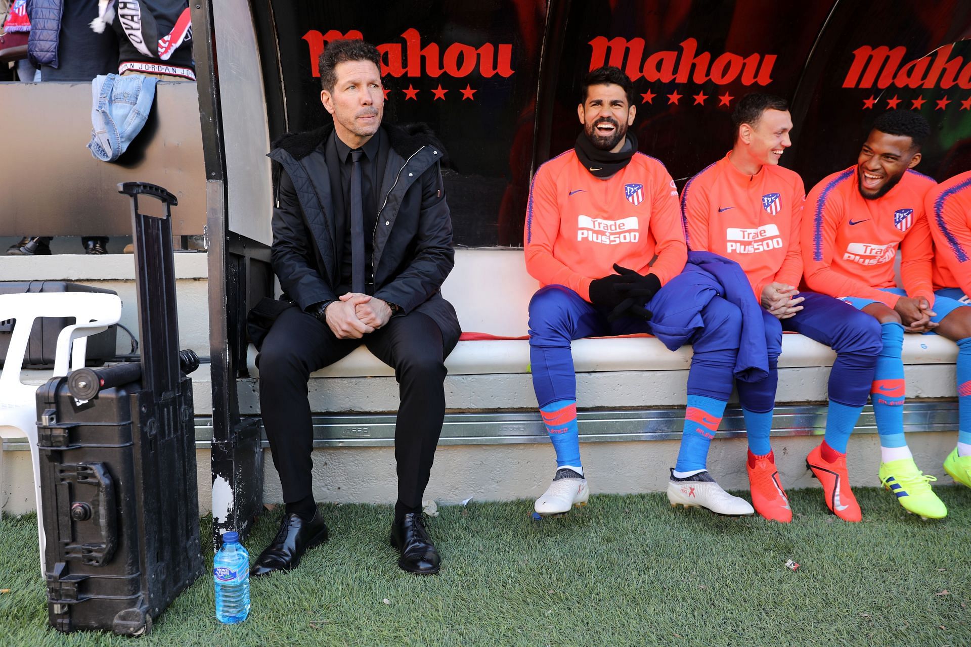 Diego Simeone (left) and Diego Costa (second left) on the Atletico Madrid bench