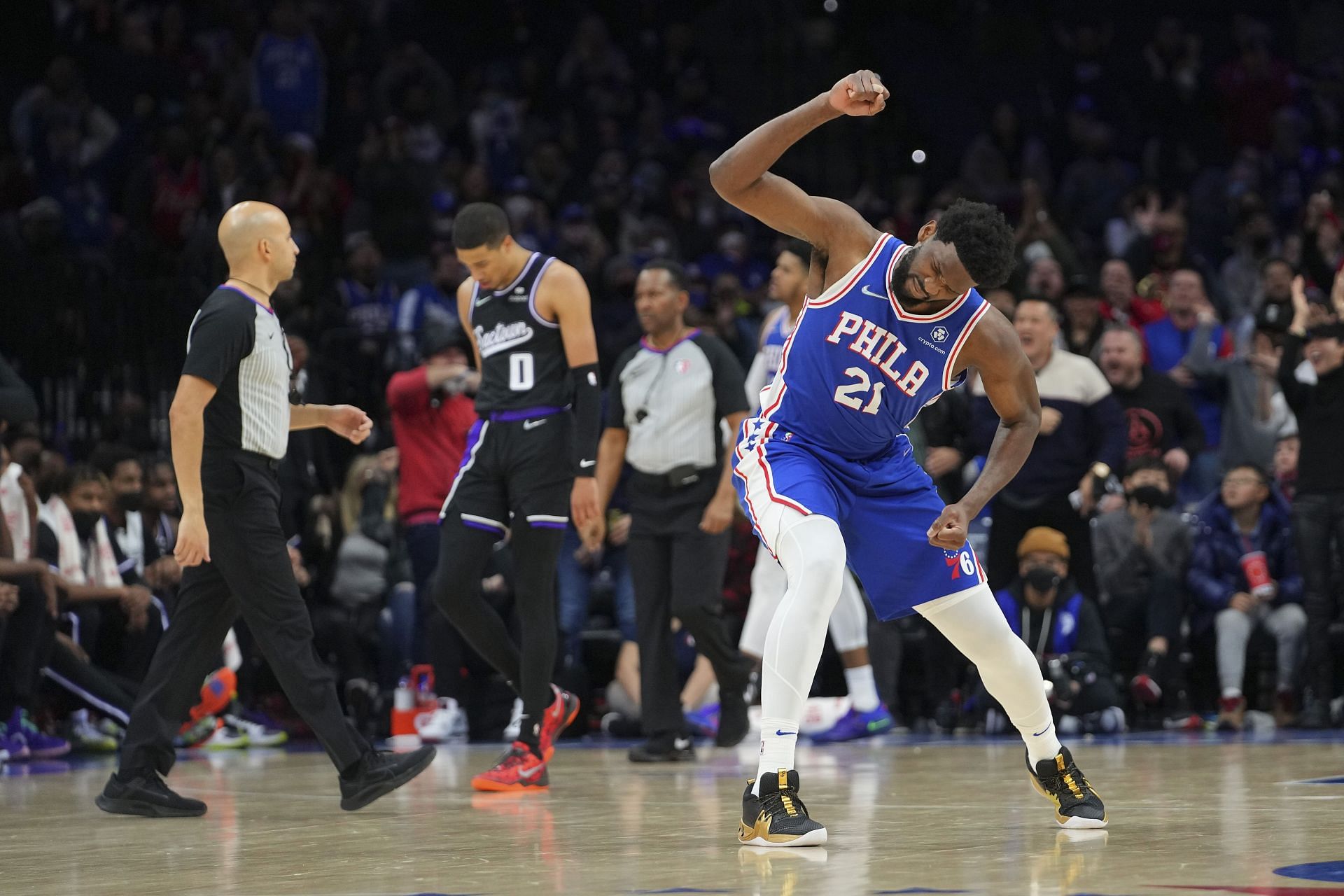 Joel Embiid #21 of the Philadelphia 76ers reacts in front of Tyrese Haliburton #0 of the Sacramento Kings in the second half at the Wells Fargo Center on January 29, 2022 in Philadelphia, Pennsylvania. The 76ers defeated the Kings 103-101.