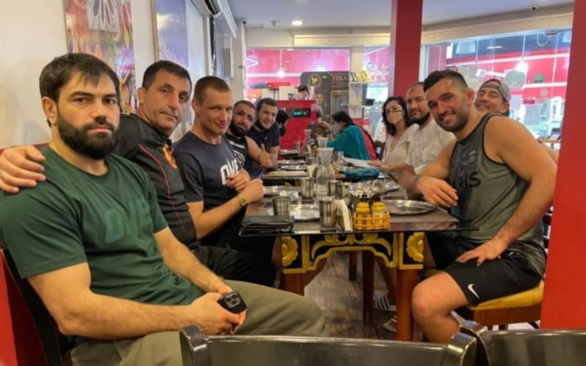Reinier de Ridder (3rd from left) and Kiamrian Abbasov (4th from left) sit beside each other to eat. [Photo: Reinier de Ridder&#039;s Instagram Story]
