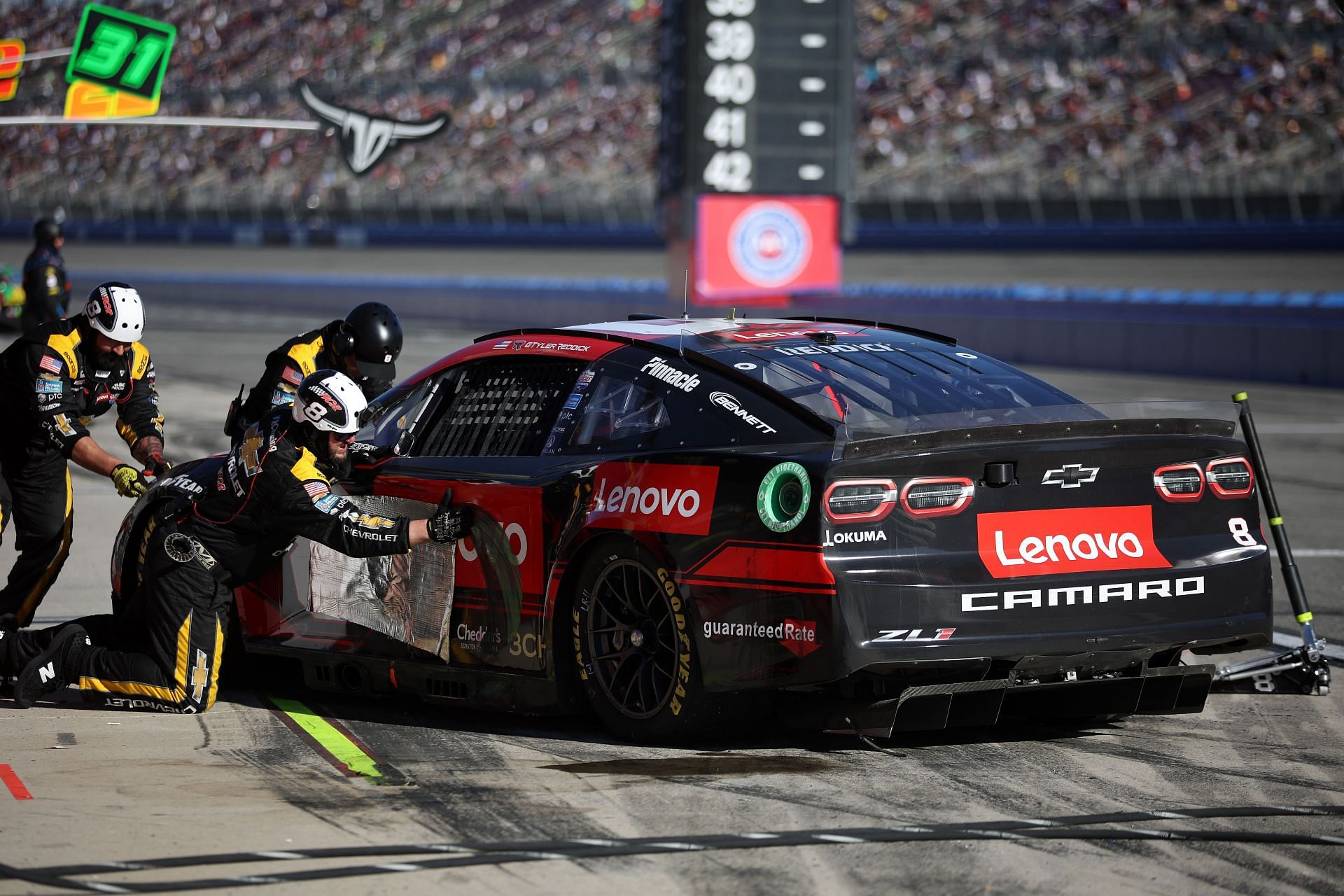 Car #8 driver Tyler Reddick&#039;s pit crew tries to repair his Chevrolet Camaro ZL1 after contact with William Byron (Photo by James Gilbert/Getty Images)
