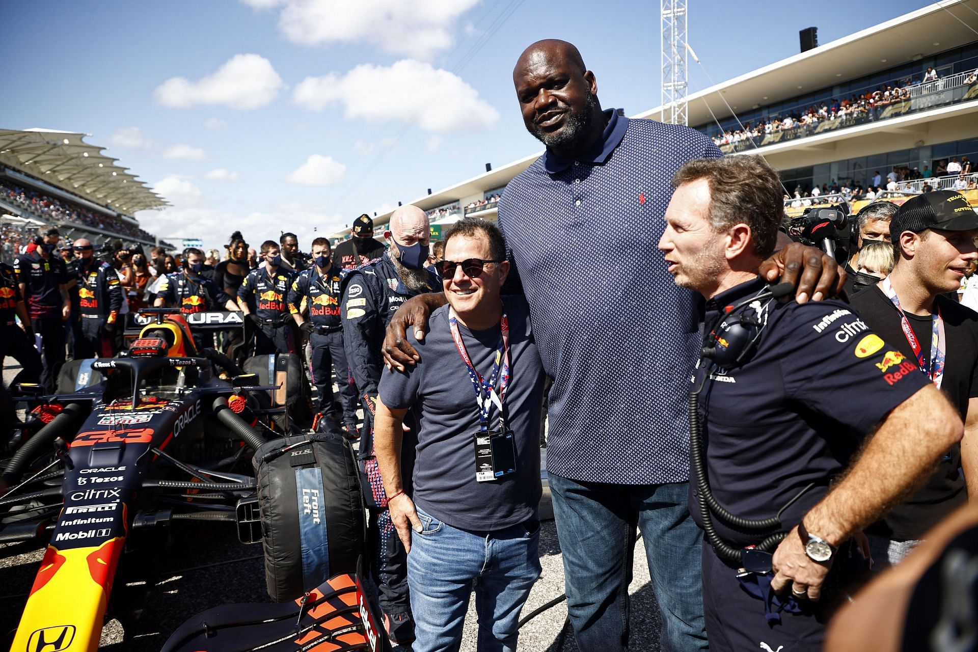 Shaq at the F1 Grand Prix with a couple of fans